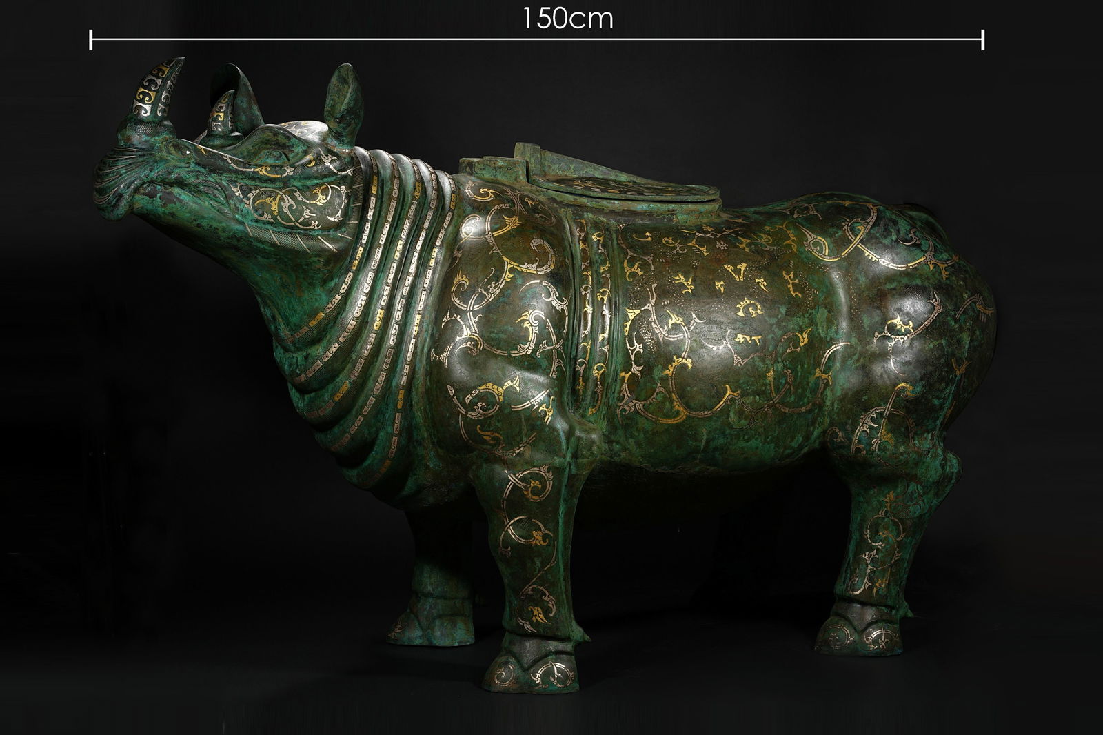 BRONZE GILDED GOLD AND SILVER RHINOCEROS VASE OF THE HAN DYNASTY: Name BRONZE GILDED GOLD AND SILVER RHINOCEROS VASE OF THE HAN DYNASTY Dimensions W: 150 CM Condition Additional photographs and condition reports are available upon request as a cour