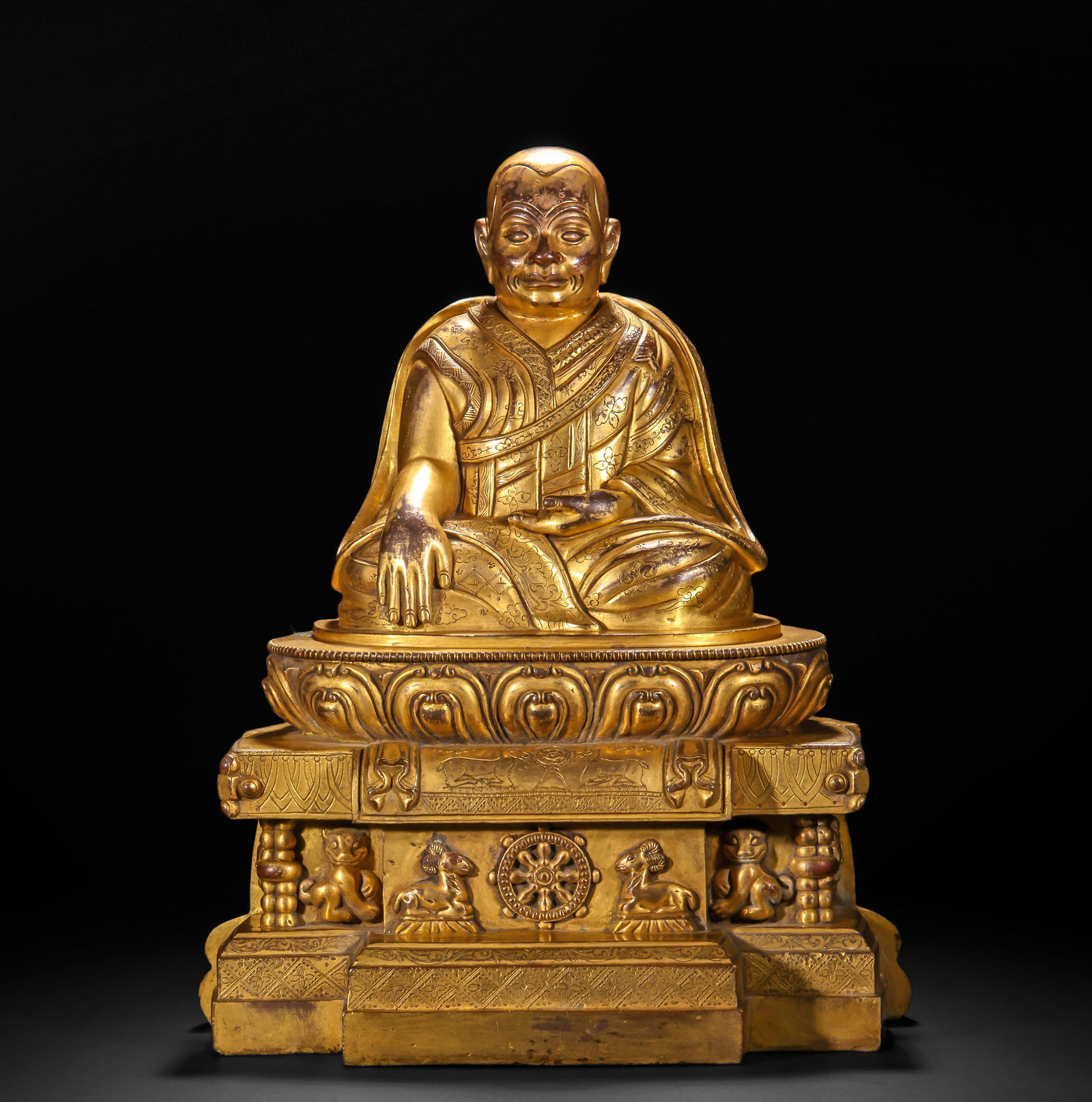 16TH-CENTURY GILDED COPPER STATUE OF THE GURU BUDDHA: Name 16TH-CENTURY GILDED COPPER STATUE OF THE GURU BUDDHA Dimensions H: 36 CM; W: 30 CM; WEI GHT: 10020 G Condition Additional photographs and condition reports are available upon re