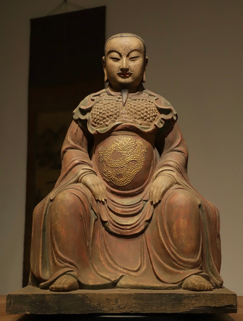 A WOODCARVING OF EMPEROR ZHENWU FROM THE MING DYNASTY: Name A WOODCARVING OF EMPEROR ZHENWU FROM THE MING DYNASTY Dimensions H:62cm(24.41in) L:43cm(16.93in) W:28cm(11.02in) This is a Ming Dynasty wooden painted statue of Zhenwu Dadi (Xuantian Tianzun). Ca