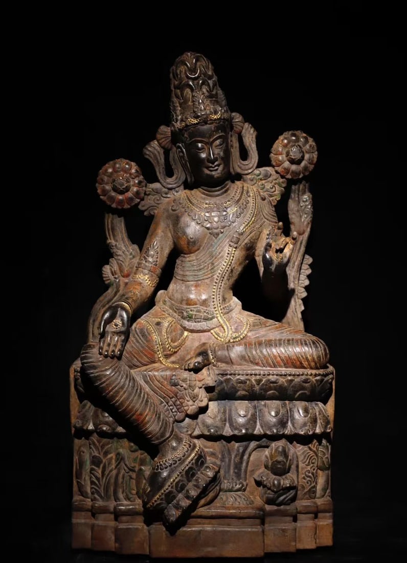 12TH-CENTURY PAINTED GUANYIN ON BLUESTONE: Name 12TH-CENTURY PAINTED GUANYIN ON BLUESTONE Dimensions H:100cm(39.37in)W:58cm(22.83in)T:35cm(13.78in)Weight:250000g This is a stone statue of Avalokiteshvara (or Tara) in royal ease posture,