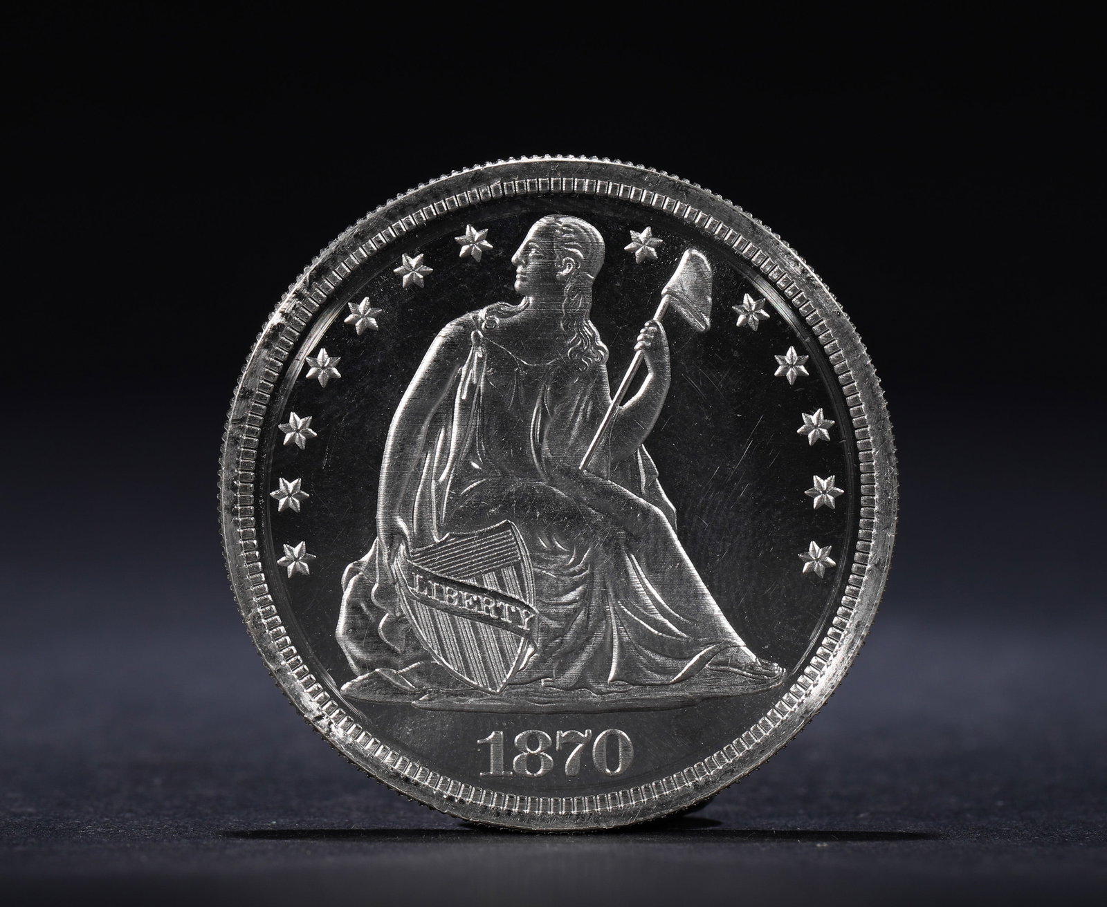 A SILVER COIN OF THE SEATED STATUE OF LIBERTY FROM 1870 (1 of 3)