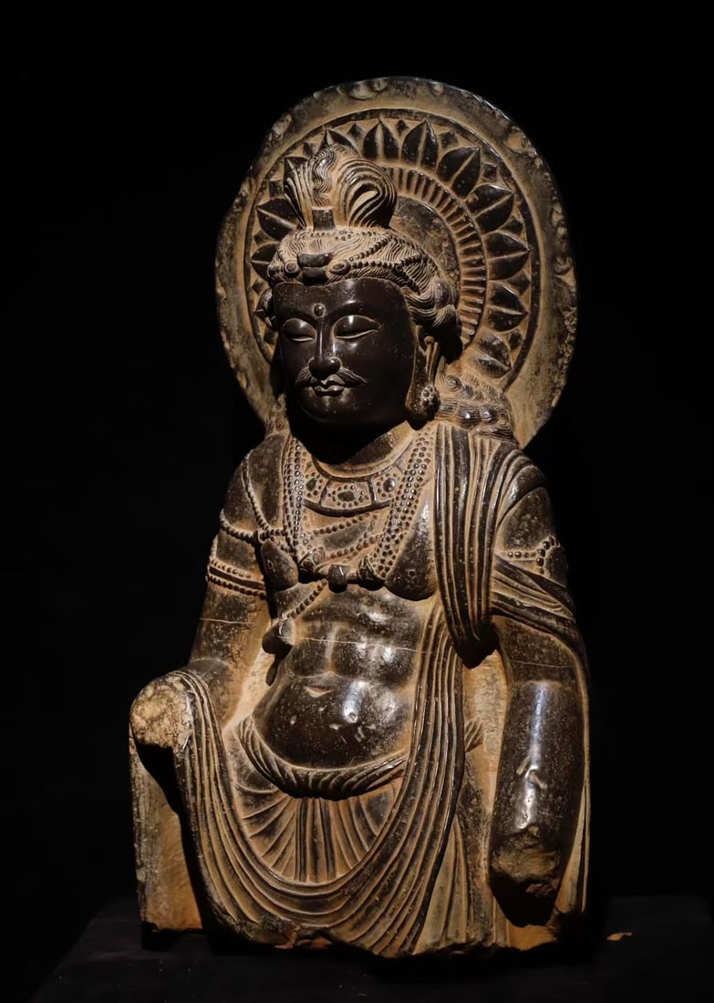 3RD CENTURY GANDHARA STONE BUDDHA: Name 3RD CENTURY GANDHARA STONE BUDDHA Dimensions H:92cm(36.22in)W:50cm(19.69in)T:25cm(9.84in)Weight:200000g This is a seated Bodhisattva stone sculpture in Gandhara style, dating from the 2nd to 4th