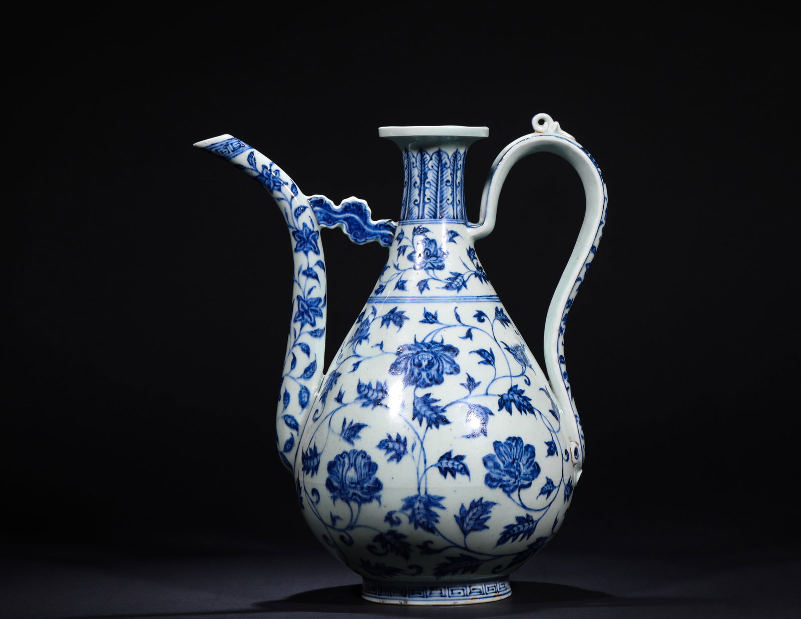 YUAN DYNASTY BLUE AND WHITE ENTWINED FLOWER PATTERN EWER: Name YUAN DYNASTY BLUE AND WHITE ENTWINED FLOWER PATTERN EWER Dimensions H:32cmW:26cm Condition Additional photographs and condition reports are available upon request as a courtes