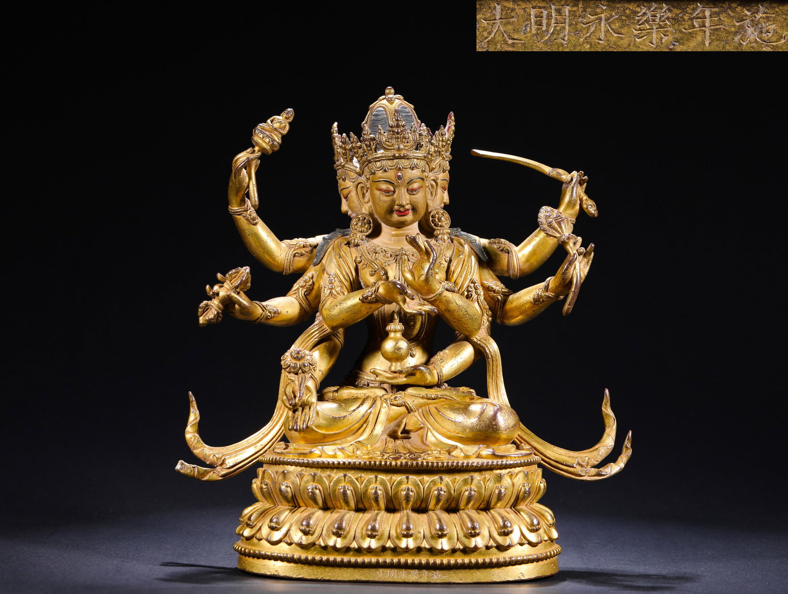 A GILDED BRONZE STATUE OF MANJUSRI BODHISATTVA WITH EIGHT ARMS FROM YONGLE OF THE MING DYNASTY (1 of 8)