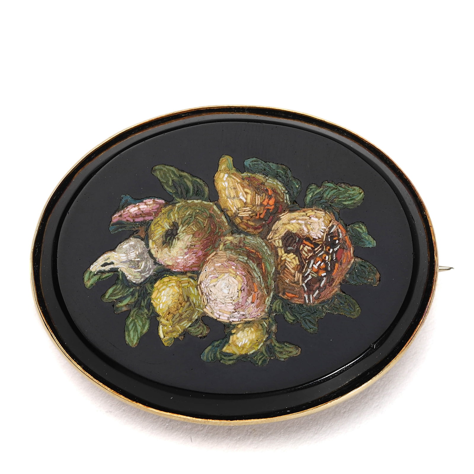 MICROMOSAIC BROOCH WITH FRUIT STILL LIFE ON BLACK ONYX: Length: 1 3/4 in. (4.5 cm), Width: 1 7/16 in. (3.7 cm), Weight: 24.3 g This refined micromosaic brooch features a richly detailed fruit still life set against a black onyx ground, framed in a polished
