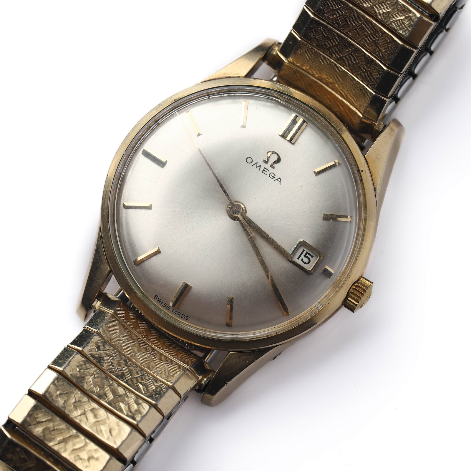 OMEGA GOLD-TONE AUTOMATIC DATE WRISTWATCH: Dimensions Dial diameter: 1 7/16 in (37.2mm) Description A mid-20th century Omega wristwatch featuring a gold-tone case with a silvered sunburst dial, applied baton hour markers, and dauphine hands.