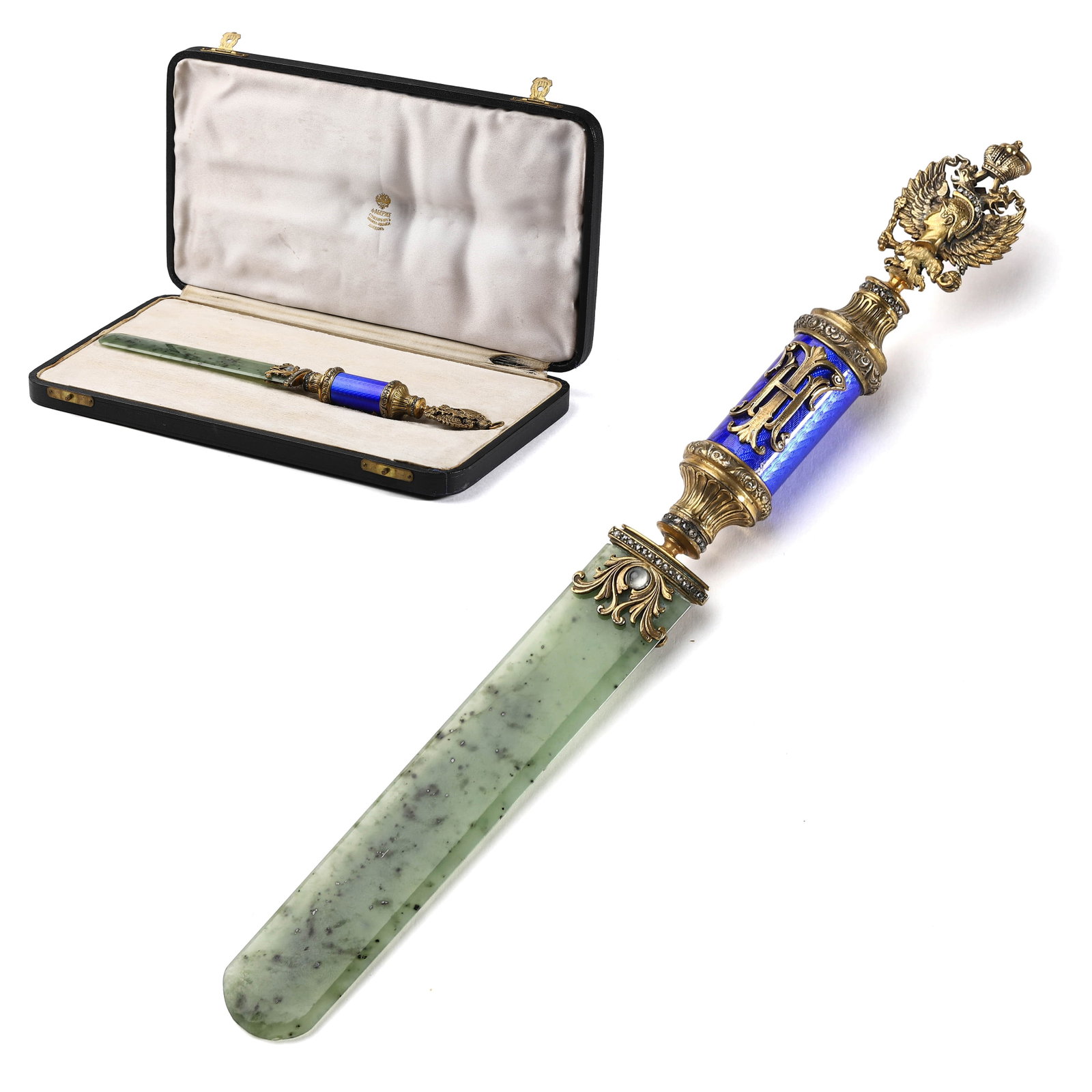 FABERGÉ-STYLE NEPHRITE, ENAMEL, AND GILT METAL LETTER OPENER: Length: 10 5/8 in. (27 cm) Description & Analysis: This exceptional letter opener is executed in the Faberge style, showcasing a luxurious blend of nephrite, enamel, and gilt metal. The blade is finel