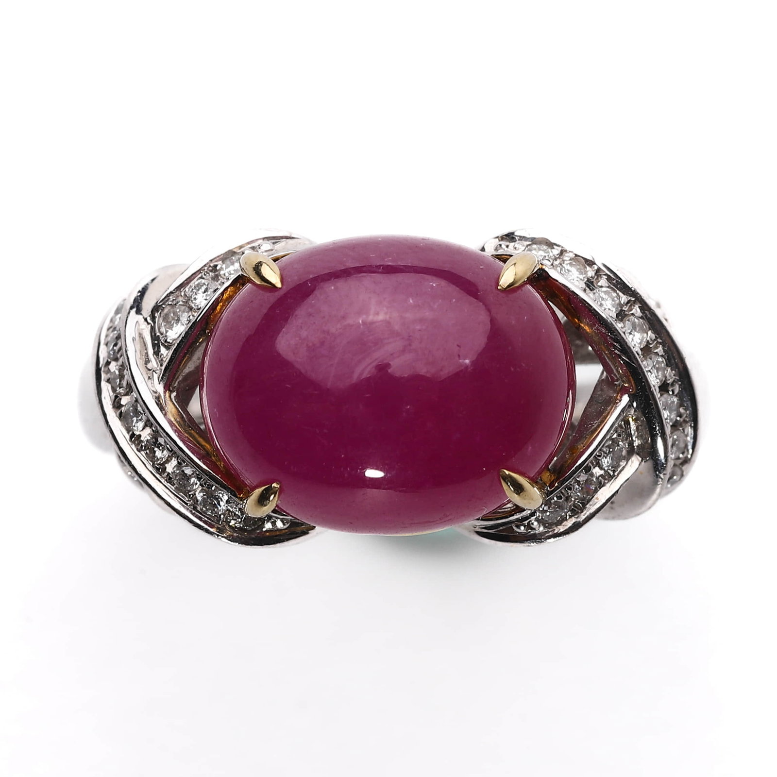 PLATINUM AND 18K GOLD RING WITH NATURAL RUBY AND DIAMONDS: Dimensions: Inner diameter: 23/32 in. (18.4 mm); Weight: 14.1 g This sophisticated ring features a striking 9.26-carat natural ruby in cabochon cut, held in four prongs atop an elegant setting of plat