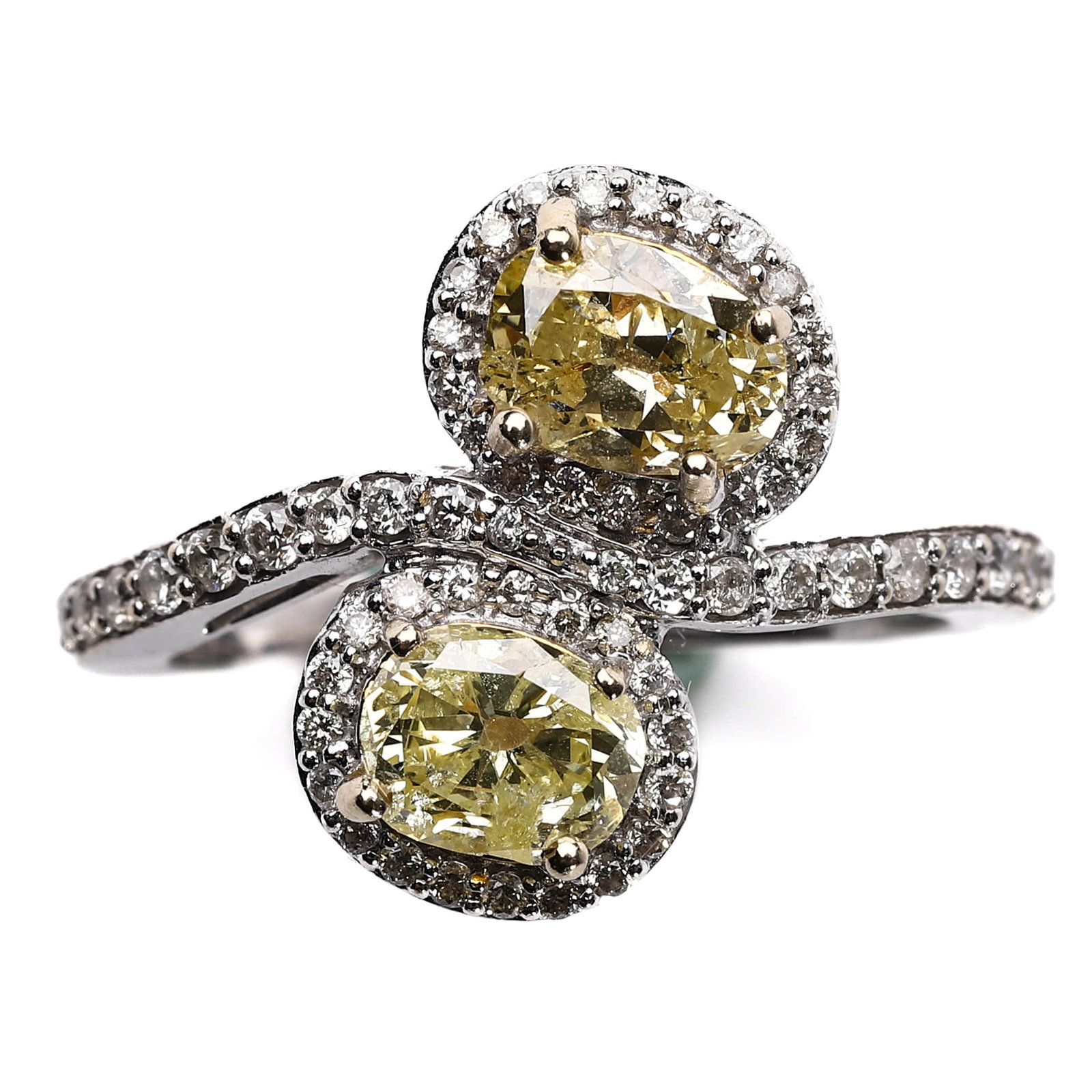 A YELLOW DIAMOND AND DIAMOND RING, SET IN WHITE GOLD.: Dimensions:Ring Size: 17.5 mm (approximately 7),Diamond (each): 5.1 x 6.8 mm,Weight: 4.2 g Description:This elegant ring features two sparkling yellow diamonds, each surrounded by a halo of smaller