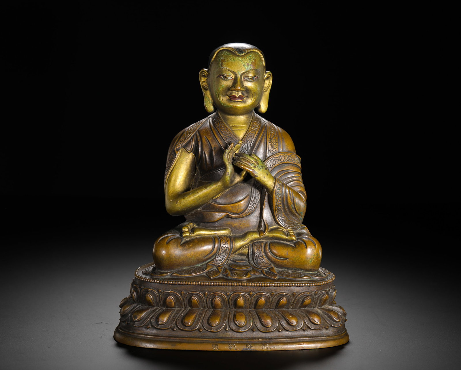 A SEATED FIGURE OF A COPPER ALLOY MASTER FROM THE QING DYNASTY (1 of 12)