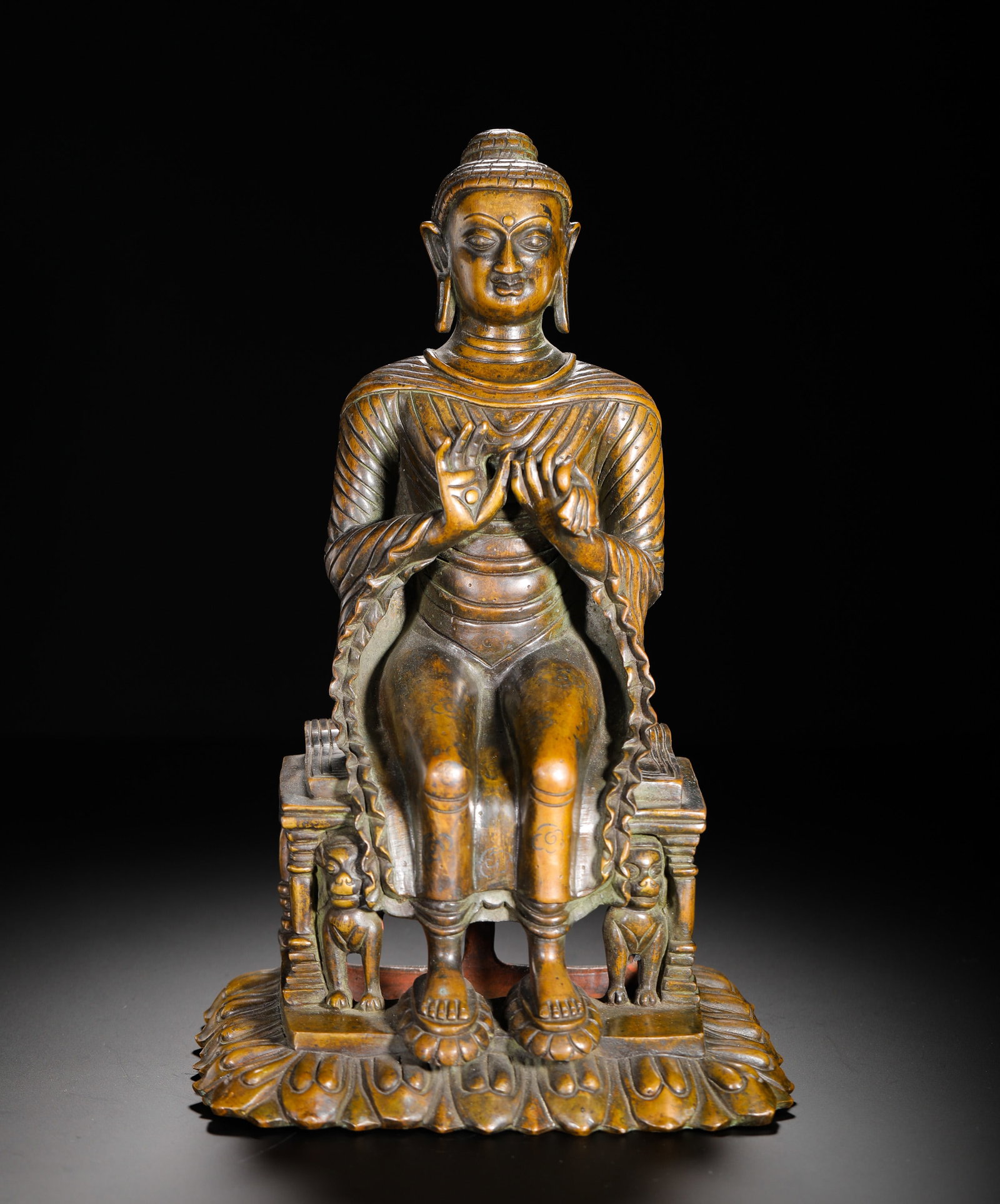 A 7TH-CENTURY COPPER ALLOY MAITREYA BUDDHA STATUE: H:30cm(11.81in) W:17cm(6.69in) Weight:3760g(8.29lb)The Buddha is seated in the "European pose" (legs down), holding the teaching mudra. The style features a square face, parallel robe folds, and lions