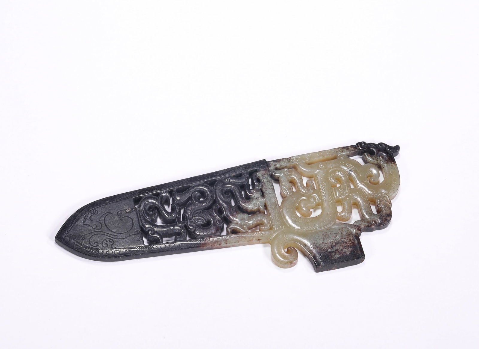 A JADE SWORD WITH DRAGON AND PHOENIX PATTERNS CARVED THROUGH FROM HETIAN IN THE HAN DYNASTY: H:5.5cm(2.17in) W:15.3cm(6.02in) Weight:60g(0.13lb)This pendant is a masterpiece of ancient jade in the Han Dynasty. Made of Hetian jade, it adopts the "oil-dyeing" process to create a distinct black-