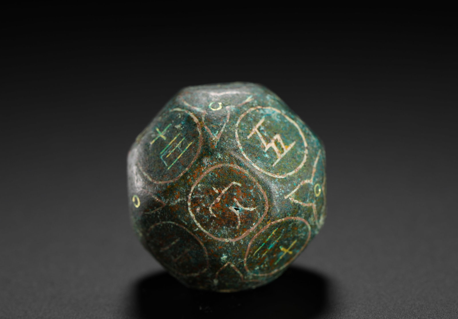 BRONZE INLAID GOLD AND SILVER TWELVE-SIDED DIVINATION DICE FROM THE WARRING STATES PERIOD TO THE HAN (1 of 9)
