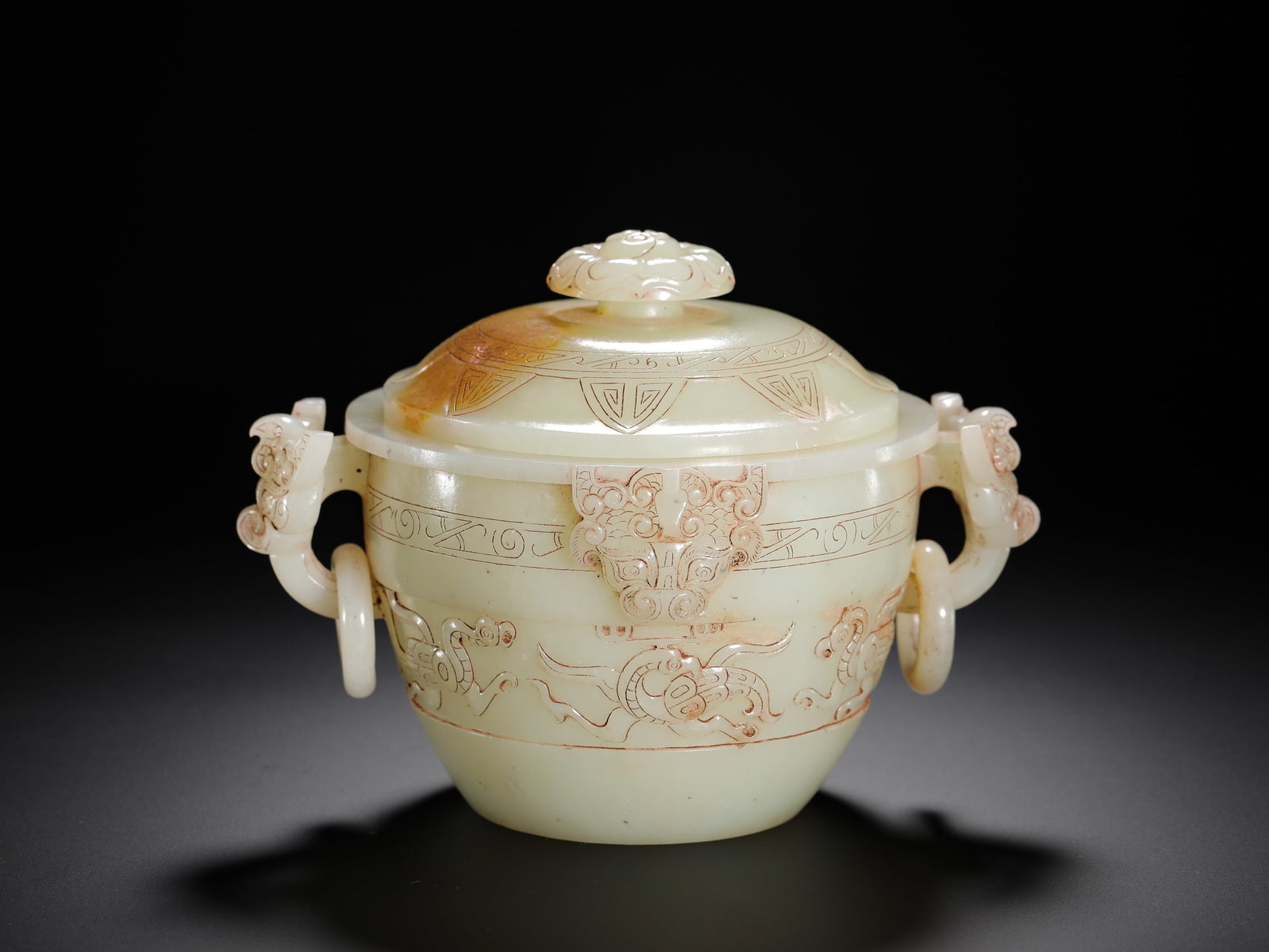 HAN DYNASTY HETIAN WHITE JADE TAOTIE PATTERNED LIVING RING COVERED STOVE: H:13cm(5.12in)W:16cm(6.30in)Weight:900g(1.98lb)Jade censers were often used for rituals or display by the nobility in the Han dynasty. The taotie motif, a traditional pattern since the Shang and Zhou 