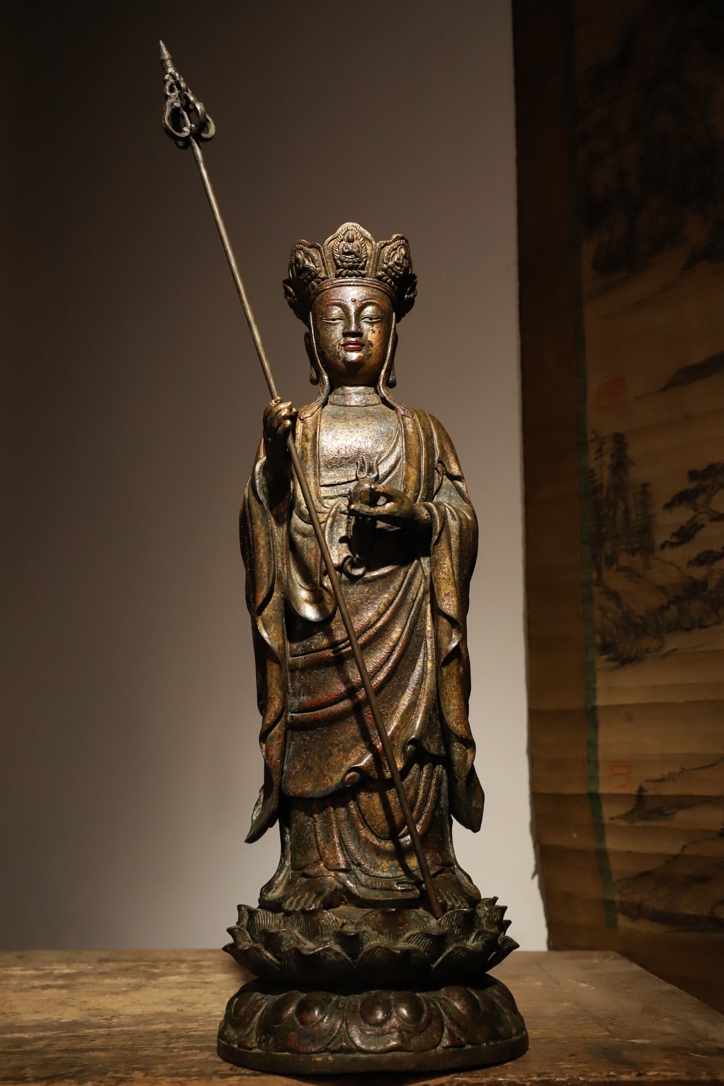BODHISATTVA DI ZANG WANG OF THE MING DYNASTY: Weight:4300g(9.48lb) H:45cm(17.72in) D:15cm(5.91in) This is a standing bronze statue of Ksitigarbha Bodhisattva from the Ming Dynasty. The Bodhisattva holds a monk's staff and stands on a lotus pedest