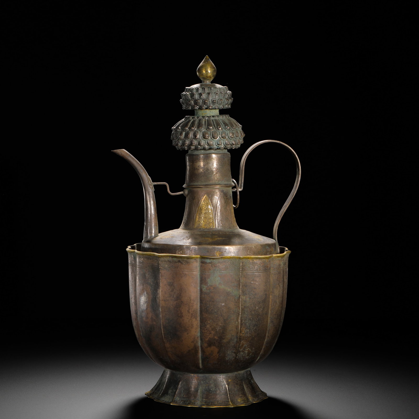 QING DYNASTY GILDED SILVER WINE POT: HEIGHT:30CM (11.81IN) WIDTH:17CM (6.69IN) WEIGHT:830G (1.83LB) SILVER PENBA POT WITH PARTIAL GILDING, QING DYNASTY. ITS LID IS DECORATED WITH DOUBLE LAYERS OF UPTURNED LOTUS PETALS, THE NECK CHASED WI