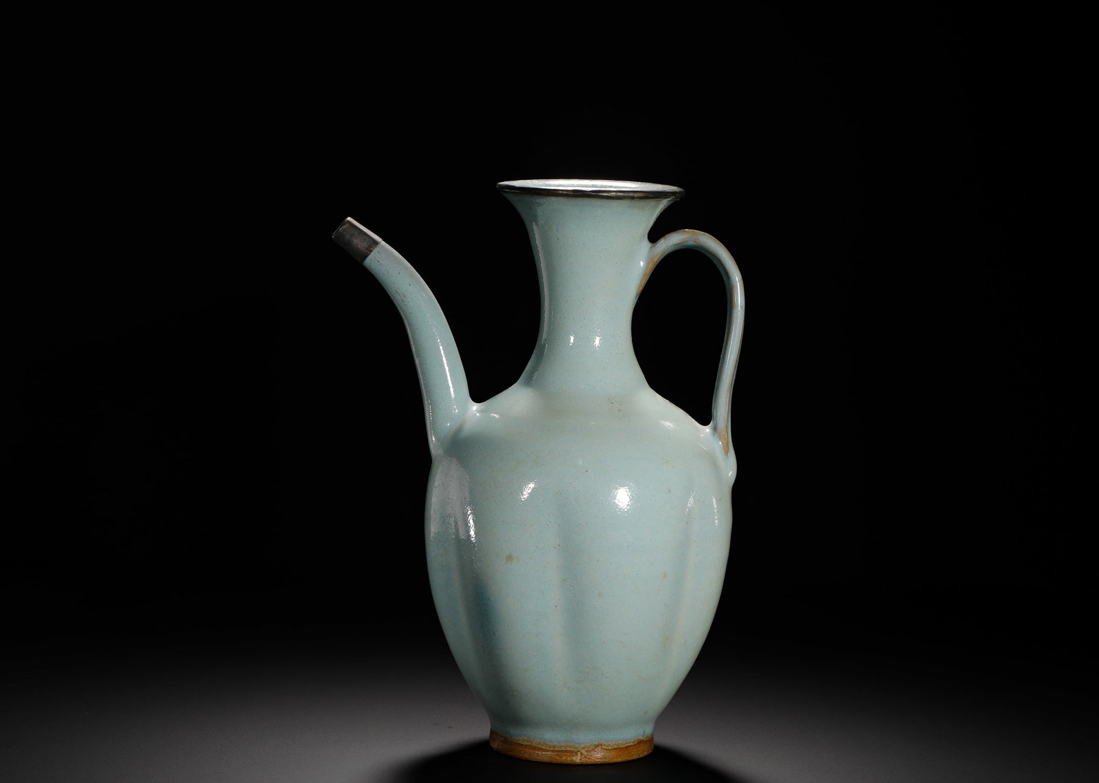 SONG JUN KILN SKY BLUE GLAZED MELON-SHAPED EWER: HEIGHT:24CM (9.45IN) WIDTH:17.5CM (6.89IN) WEIGHT:980G (2.16LB) JUN KILN MELON RIBBED EWER WITH SKY-CELADON GLAZE AND SILVER MOUNT, SONG DYNASTY. THE MELON-SHAPED BELLY IS COVERED IN CREAMY PALE BLUE 