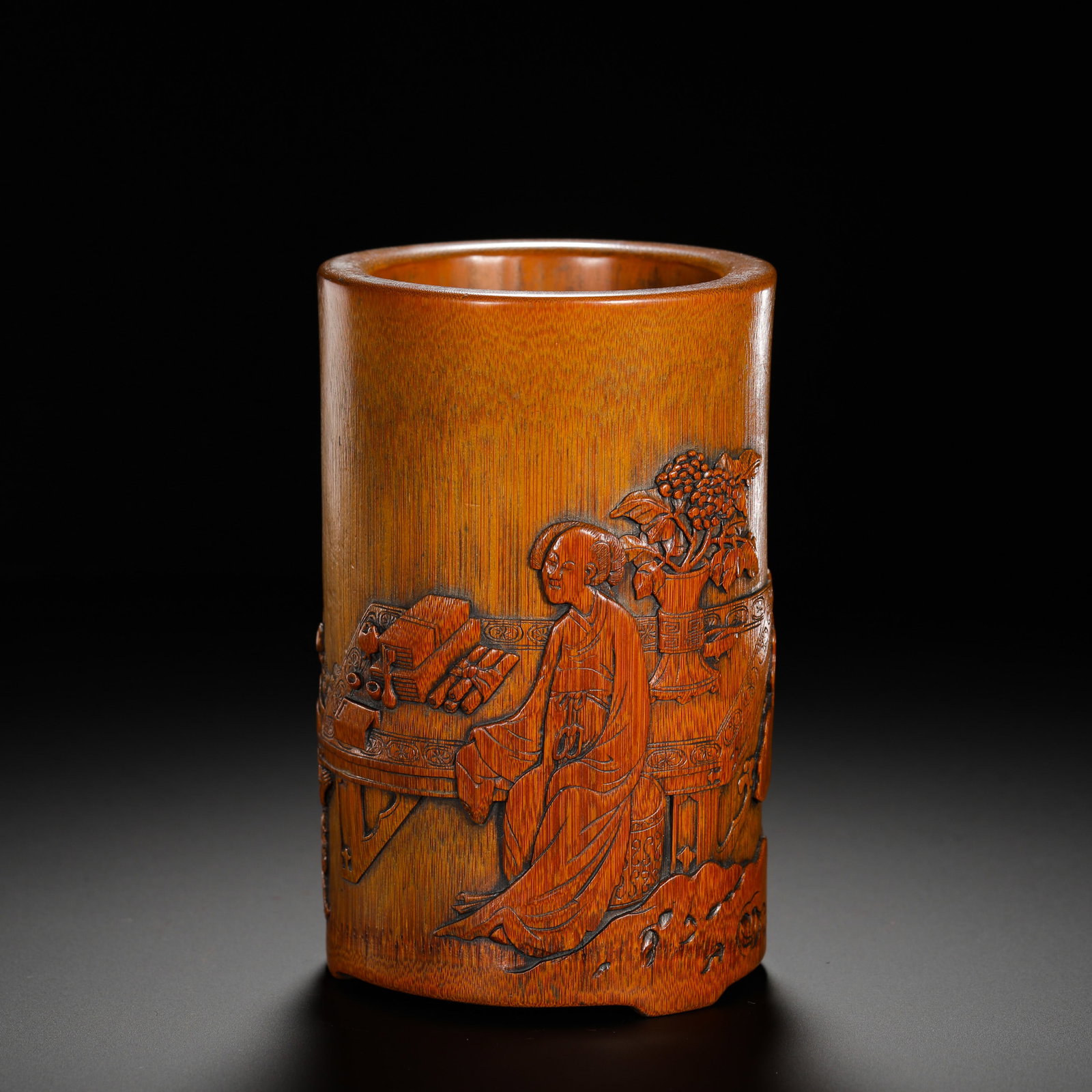 QING DYNASTY BAMBOO-CARVED PEN HOLDER FEATURING A LADY READING: HEIGHT:15CM (5.91IN) WIDTH:9.5CM (3.74IN) WEIGHT:250G (0.55LB) QING DYNASTY BAMBOO CARVED BRUSH POT FOR SCHOLAR??S ??STUDIO, MADE FROM A SINGLE PIECE OF AGED BAMBOO. CYLINDRICAL SHAPE WITH SMOOTHLY PO