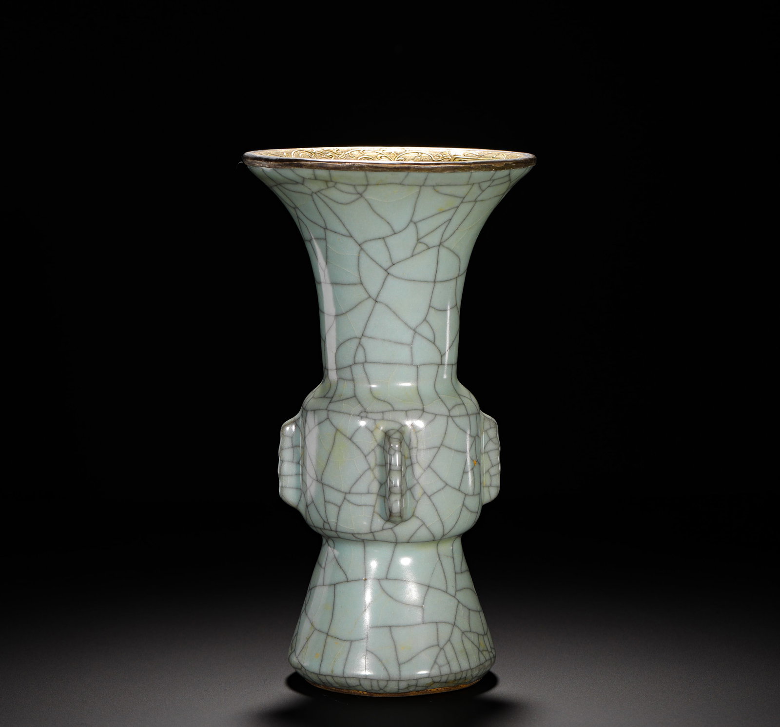 SONG DYNASTY OFFICIAL KILN POWDER BLUE GLAZE THROUGH-EAR GU PATTERN GU: HEIGHT:22.5CM (8.86IN) WIDTH:12.5CM (4.92IN) WEIGHT:910G (2.01LB) OFFICIAL KILN CELADON GU-SHAPED VASE WITH TUBE HANDLES AND GILDED RIM, SONG DYNASTY. MODELED AFTER SHANG-ZHOU BRONZE RITUAL GU VESSEL,