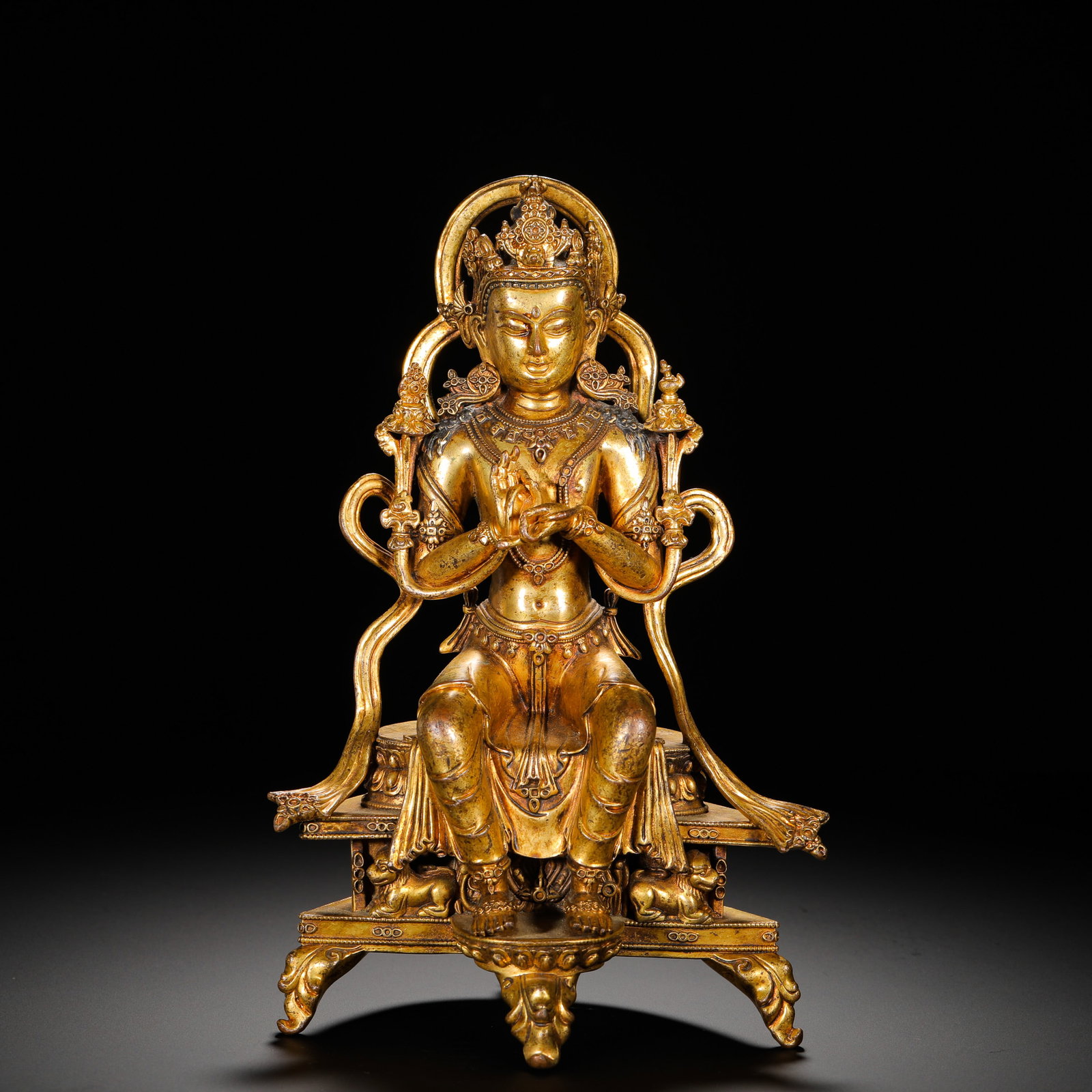 A SEATED STATUE OF MAITREYA BODHISATTVA IN GILDED BRONZE FROM THE QING DYNASTY: HEIGHT:25CM (9.84IN) WIDTH:16CM (6.30IN) WEIGHT:2690G (5.93LB) FULLY GILDED COPPER STATUE OF MAITREYA BODHISATTVA, QING TIBETAN BUDDHISM. THE BODHISATTVA SITS IN RELAXED FOOT-DOWN POSTURE, WEARING ELA