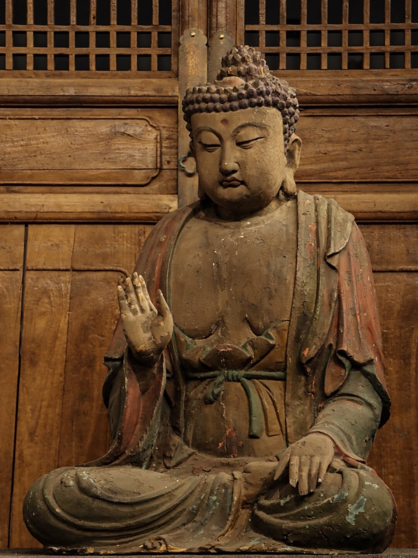 MING DYNASTY NANMU CARVINGS OF SAKYAMUNI SITTING BUDDHA: H:90CML:66CMW:42CM SAKYAMUNI BUDDHA IS THE FOUNDER OF BUDDHISM. THIS STATUE IS NOT ONLY A CARRIER OF RELIGIOUS BELIEFS, BUT ALSO A TANGIBLE EVIDENCE OF THE DEEP INTEGRATION OF ANCIENT CHINESE WOODCARV