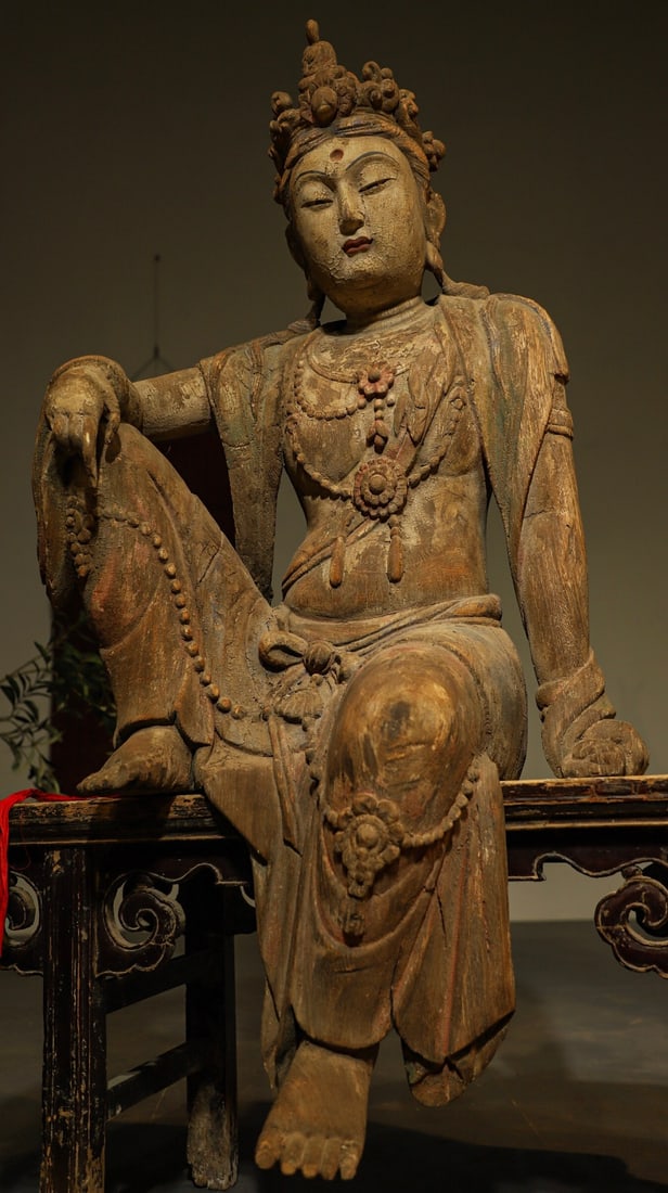 MING DYNASTY NANMU ZIZAI GUANYIN BODHISATTVA: H:125CML:66CMW:55CM THE THEME OF "WATER MOON GUANYIN" ORIGINATES FROM BUDDHIST SCRIPTURES, SYMBOLIZING THAT BUDDHISM IS LIKE THE MOON IN WATER, BEING ILLUSORY AND INSUBSTANTIAL. THIS TYPE OF STATUE BE