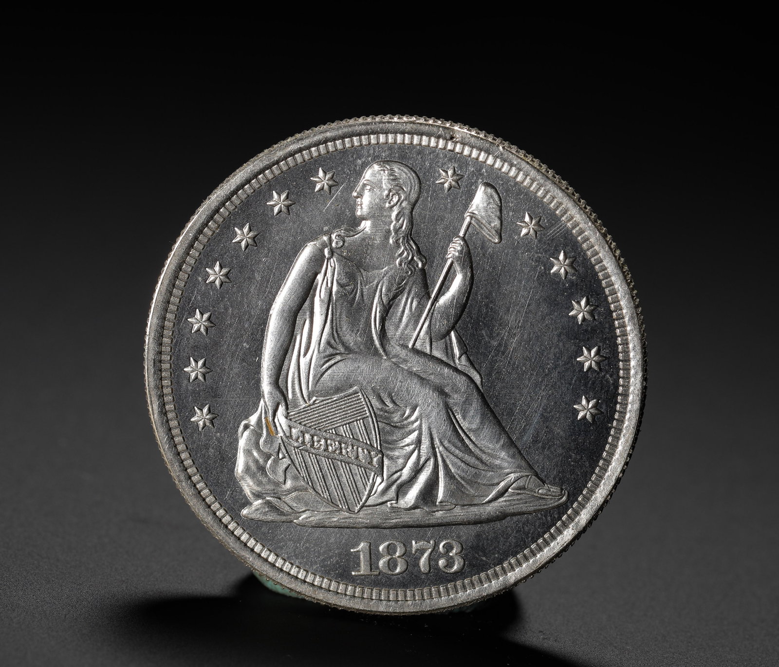 AMERICAN SILVER COIN: D:3.9CM (1.54IN) WEIGHT:27G (0.06LB) THE FINAL-YEAR ISSUE OF THE SEATED LIBERTY SILVER DOLLAR SERIES, MINTED JUST BEFORE THE INTRODUCTION OF THE TRADE DOLLAR, MARKING THE END OF AN ERA IN AMERICAN COI