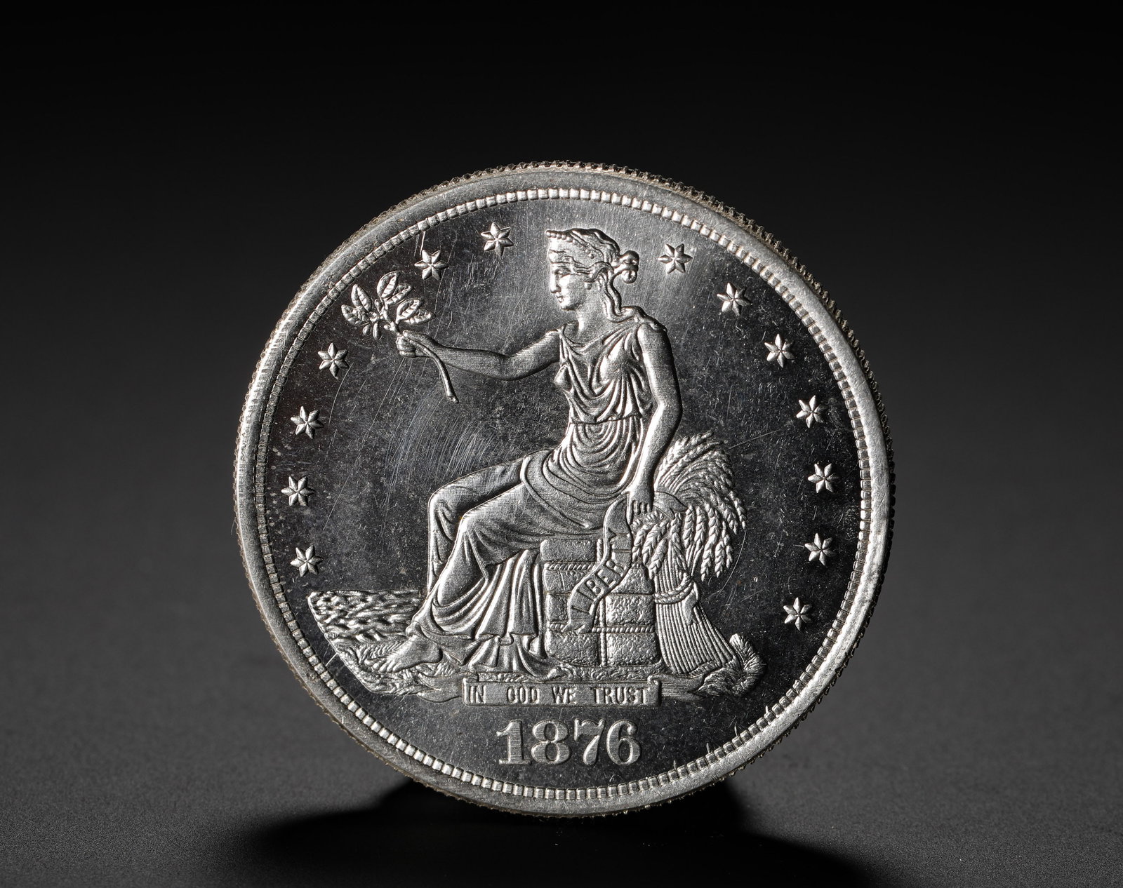 AMERICAN SILVER COIN: D:3.9CM (1.54IN) WEIGHT:27G (0.06LB) A SILVER COIN ISSUED BY THE UNITED STATES SPECIFICALLY FOR ASIAN TRADE. THE 1876 ISSUE IS A PIVOTAL YEAR IN THE SERIES, COINCIDING WITH THE U.S. CENTENNIAL, CARRYI