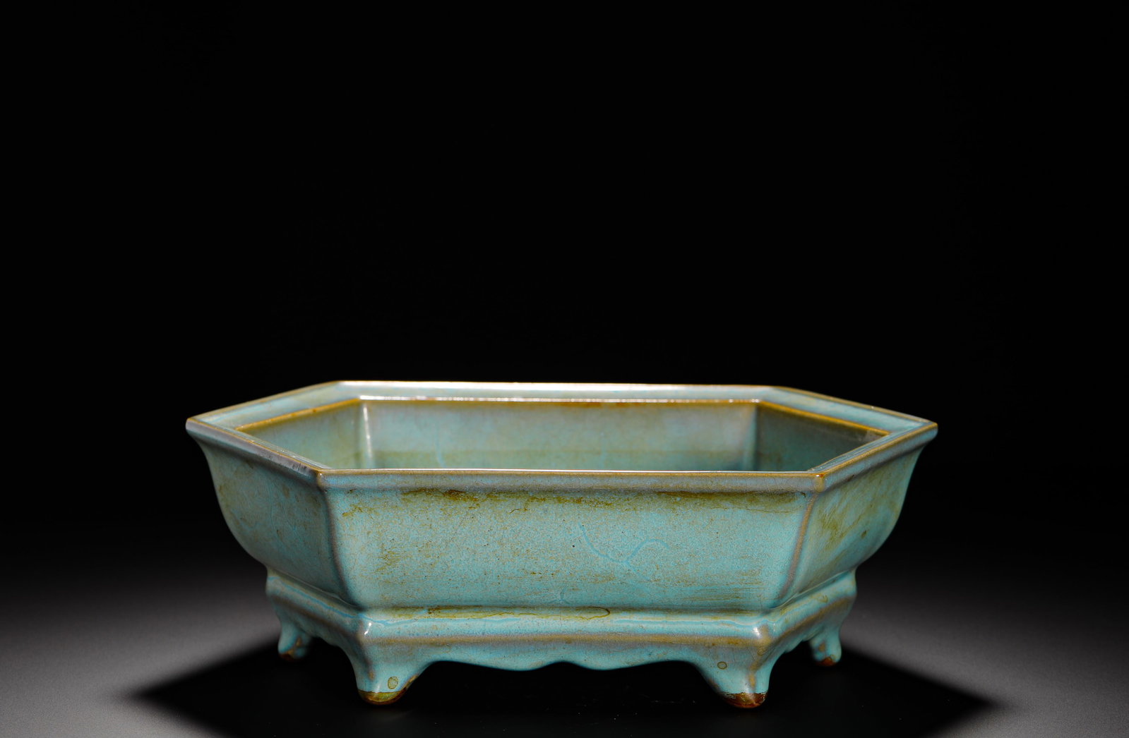 A HEXAGONAL NARCISSUS BASIN WITH CELADON GLAZE FROM JUN KILN OF THE SONG DYNASTY: HEIGHT:26.3CM (10.35IN) WIDTH:9CM (3.54IN) WEIGHT:1920G (4.23LB) JUN KILN HEXAGONAL NARCISSUS BASIN WITH SKY-BLUE GLAZE AND PALACE INSCRIPTION, SONG DYNASTY. COVERED IN SKY-BLUE KILN-TRANSFORM GLAZE W