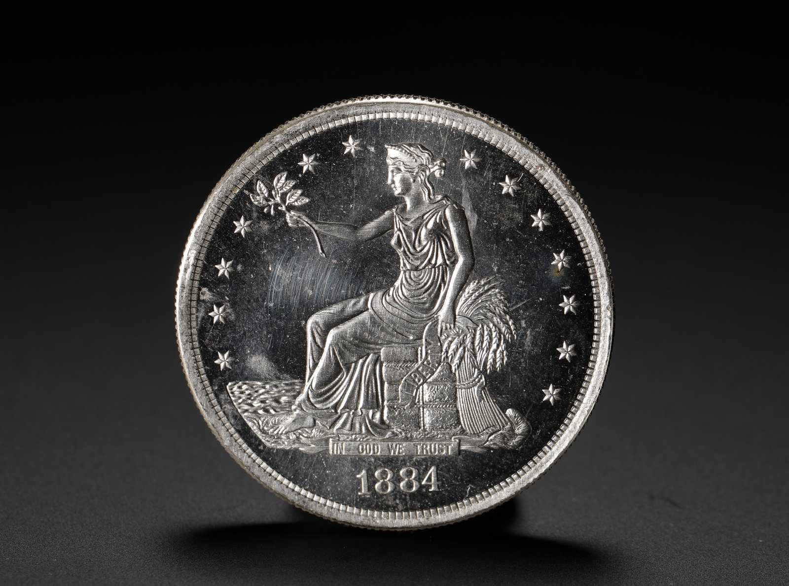 AMERICAN SILVER DOLLAR: D:3.9CM (1.54IN) WEIGHT:27G (0.06LB) A SILVER COIN ISSUED BY THE UNITED STATES SPECIFICALLY FOR EAST ASIAN TRADE MARKETS. THE 1884 ISSUE IS A RARE LATE-YEAR VERSION OF THE TRADE DOLLAR SERIES, WITH EX