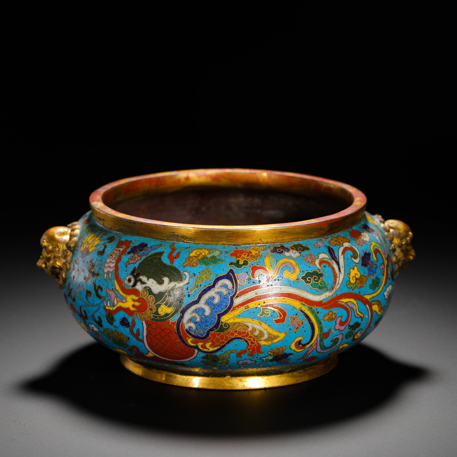 QING DYNASTY JINGTAI STYLE COPPER GILT CLOISONNE ENAMEL DRAGON AND PHOENIX BEAST EAR FURNACE: HEIGHT:7CM (2.76IN) WIDTH:16.5CM (6.50IN) WEIGHT:610G (1.34LB) GILDED BRONZE CLOISONN? DRAGON-PHOENIX CENSER WITH LION BEAST EARS, QING ANTIQUE IMITATION MARKED JINGTAI. BRONZE CORE FULLY COVERED IN T