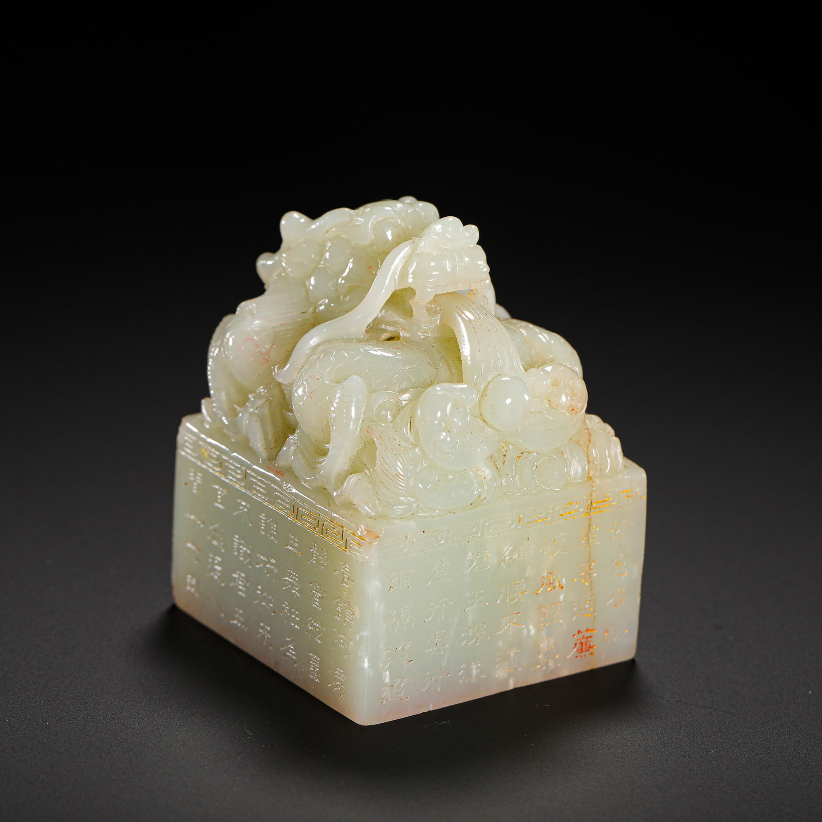 QING DYNASTY HETIAN WHITE JADE DRAGON POEM AND PROSE SQUARE SEAL: HEIGHT:6.8CM (2.68IN) WIDTH:4.8CM (1.89IN) WEIGHT:270G (0.60LB) HETIAN WHITE JADE IMPERIAL SQUARE SEAL WITH DRAGON MOTIF AND IMPERIAL POEMS, QING DYNASTY.SMOOTH PALE WHITE JADE VEINED WITH LIGHT NATUR