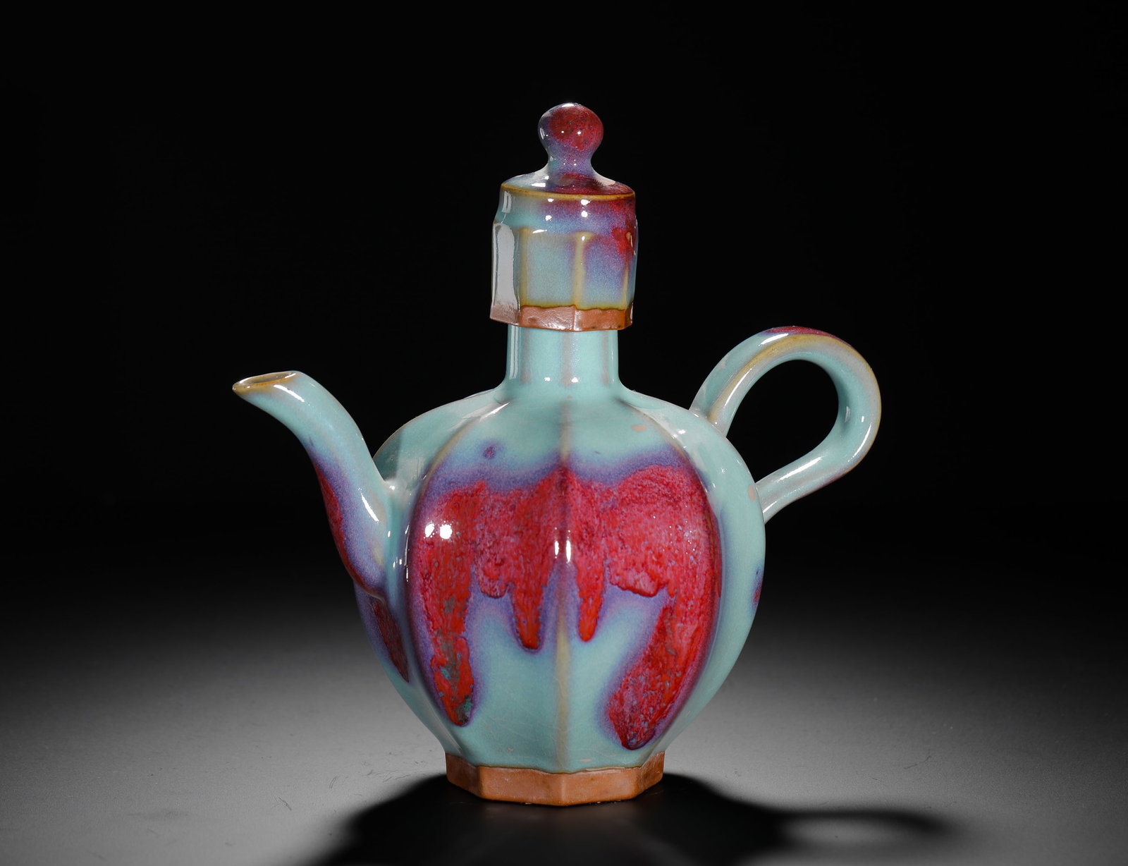 YUAN DYNASTY JUN KILN SKY BLUE GLAZED ROSE PURPLE SPOT EWER: H:20CM (7.87IN) W:20CM (7.87IN) WEIGHT:650G (1.43LB) THIS IS A JUN KILN PORCELAIN EWER WITH AN OCTAGONAL FORM. IT IS COVERED IN A CELADON GLAZE WITH STUNNING ROSE-PURPLE SPLASHES, EXEMPLIFYING THE HIG