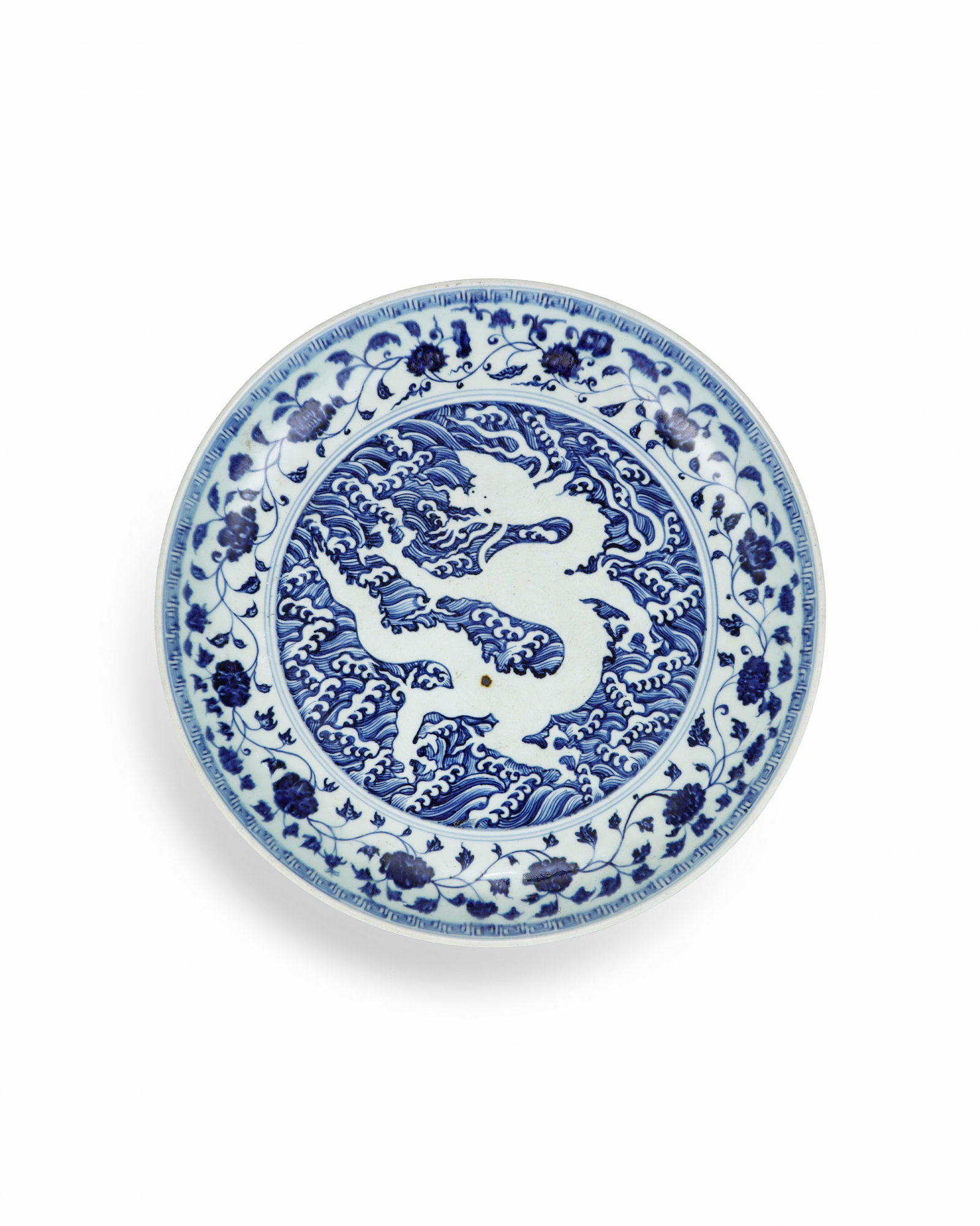A LARGE PLATE OF BLUE AND WHITE PORCELAIN WITH HIDDEN ENGRAVINGS OF SEA WATER AND DRAGON PATTERNS: L: 37CM H: 6.5CM