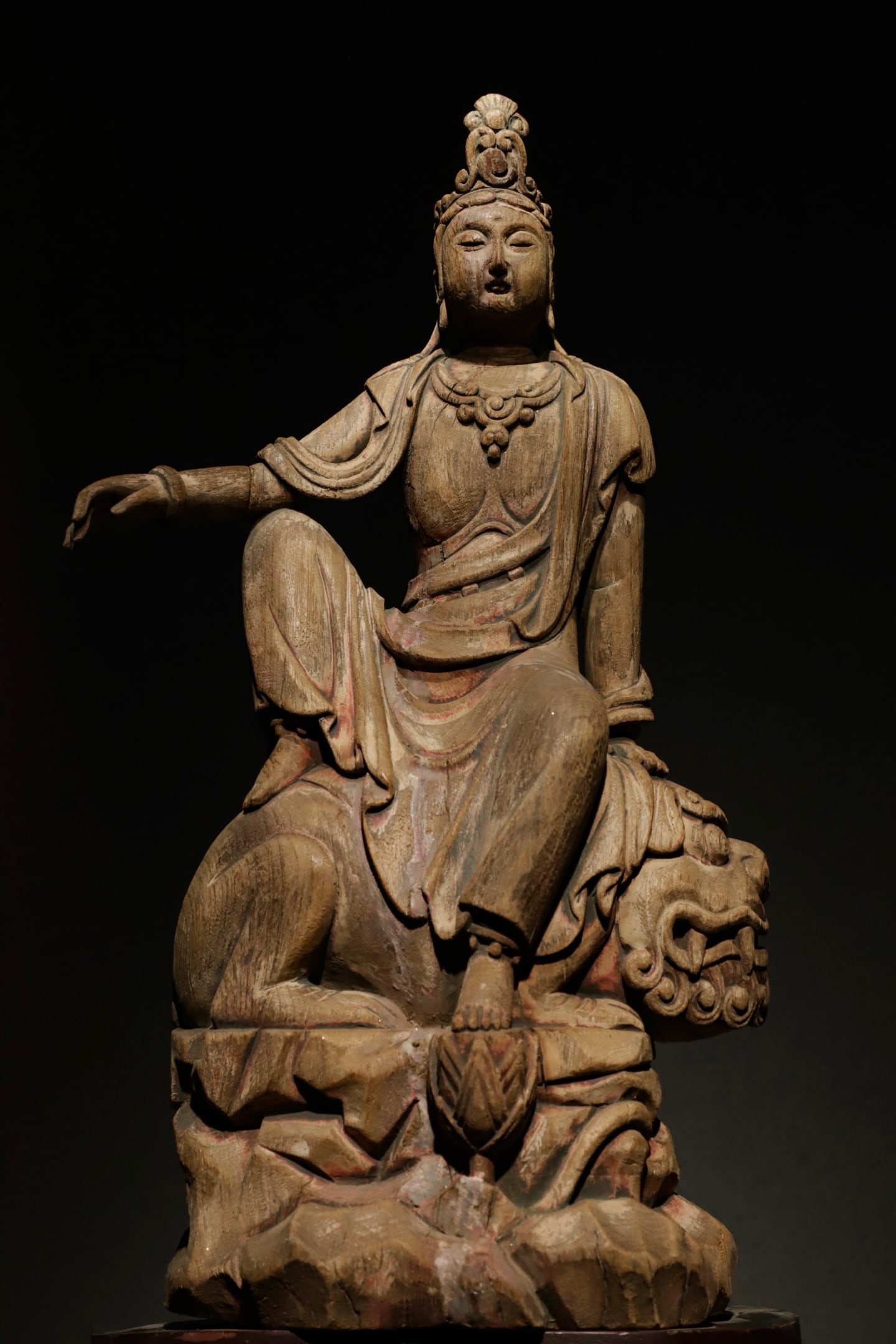 A WOODCARVING OF MANJUSRI BODHISATTVA FROM THE MING DYNASTY: H:51CM (20.08IN) L:27CM (10.63IN) W:18CM (7.09IN) MANJUSHRIISONEOFTHEFOURGREATBODHISATTVASINCHINESEBUDDHISM, REPRESENTINGWISDOM (PRAJ??) .THISSTATUE, POPULARDURINGTHEM INGANDQINGDYNASTIES, ISAFINEEXAM