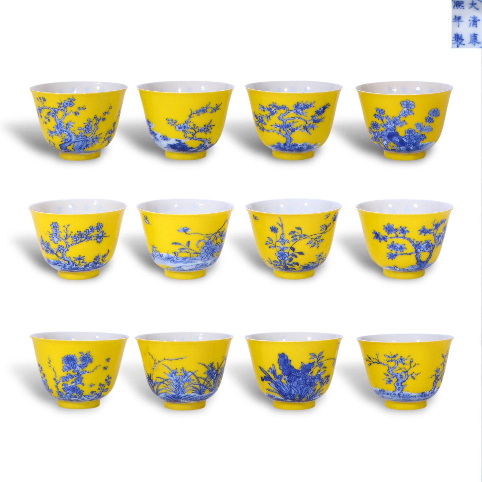 Qing Dynasty Kangxi Period,Set of Twelve Yellow-Ground Blue and White Flower God Cups: H:5cm D:6.7cm