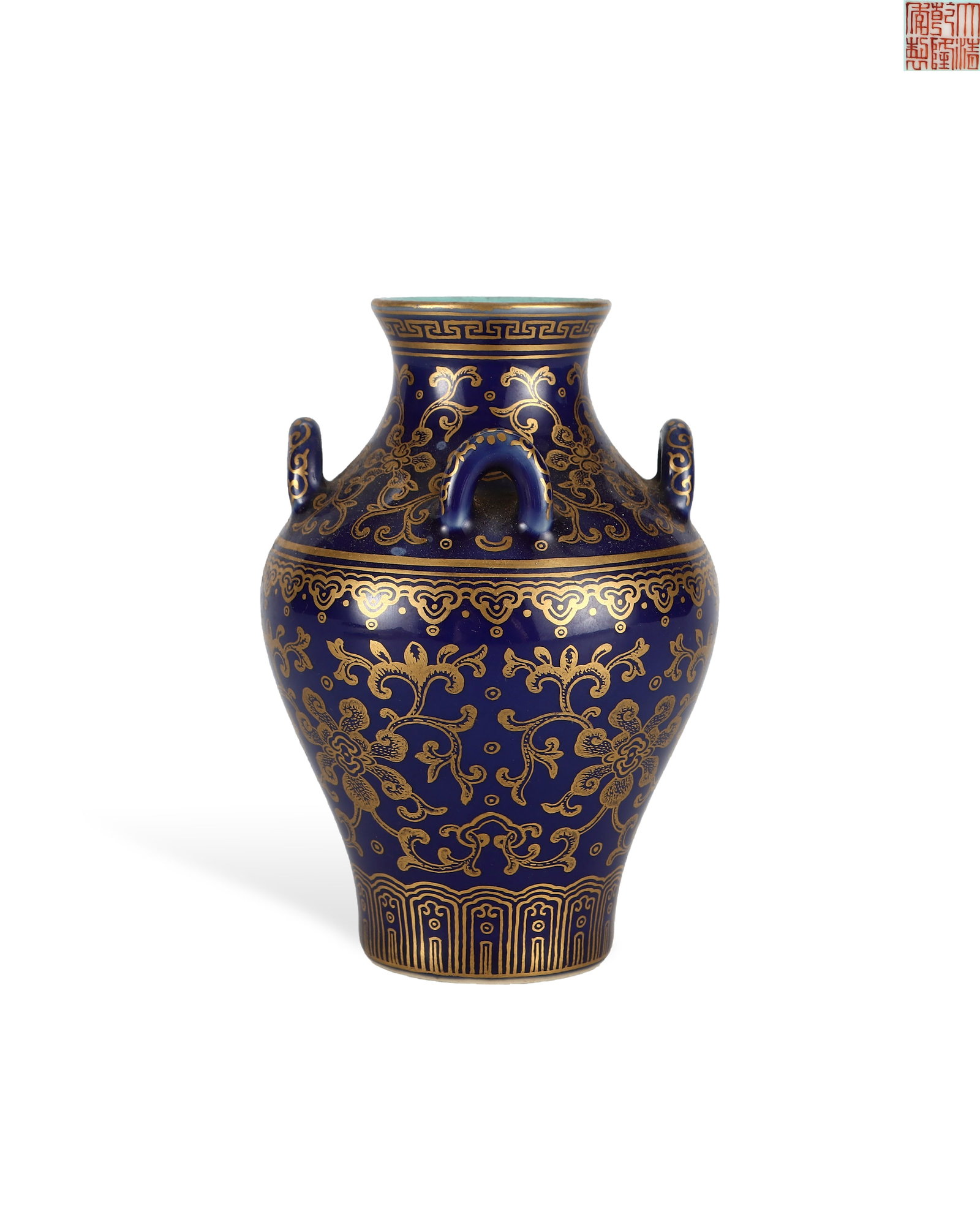 QING DYNASTY QIANLONG SACRIFICIAL BLUE, GILDED AND ENTWINED FLOWER VASE: H:11.8cm W:8cm Six-character iron-red seal script imperial mark "Made in the Qianlong Reign of the Great Qing" is inscribed on the turquoise green glazed base.Sacrificial blue with gilding is a high-g
