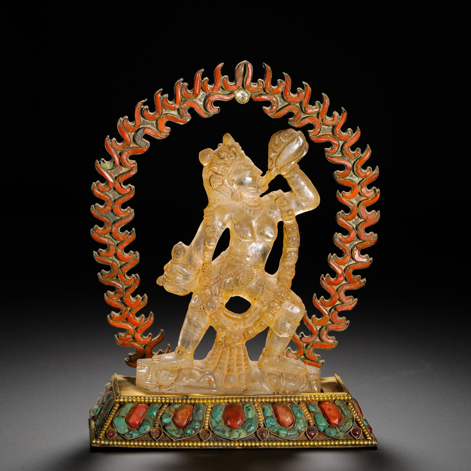 QING DYNASTY CRYSTAL GILDED INLAID TREASURE VAJRA STATUE: Height:15cm (5.91in) Width:12cm (4.72in) Weight:370g(0.82lb)Crystal Dakin statue with gilded gem-inlaid base, Qing Tibetan Esoteric Buddhism.The main figure is carved from a single block of natural wh