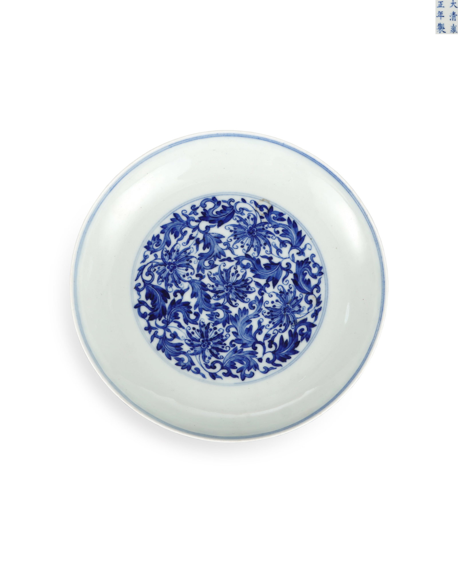 QING DYNASTY YONGZHENG BLUE AND WHITE FLOWER PLATE WITH PASSIONFLOWER PATTERN: H:2.8cm W:15.2cm This is an imperial blue-and-white plate fired in the Yongzheng reign of Qing Dynasty, crafted with fine clay and glossy pure white glaze. Interlocking passion flowers are painted wit