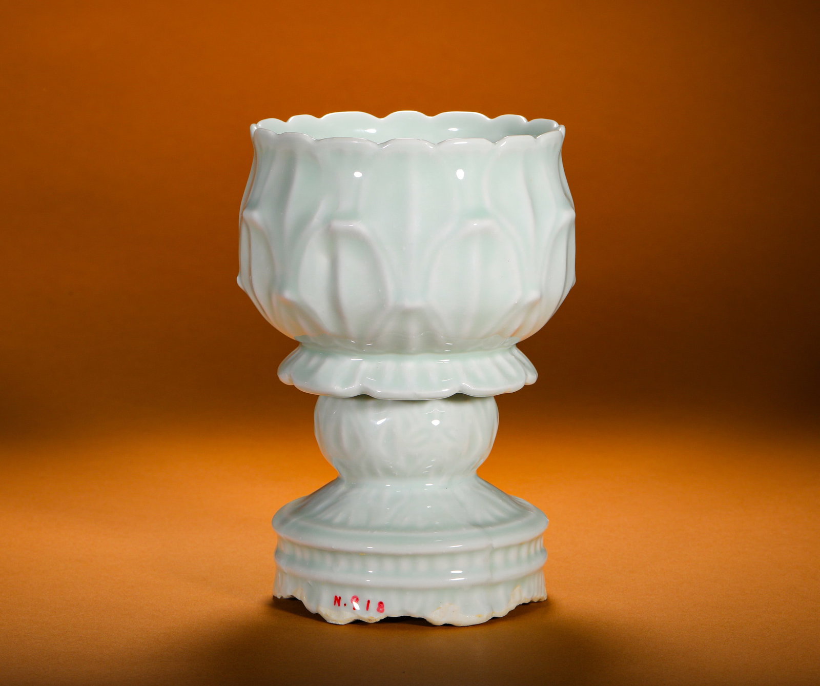 QING DYNASTY SHADOW CELADON GLAZED RELIEF LOTUS PETAL HIGH-FOOTED LOTUS ALTAR OFFERING BOWL: Height:18cm (7.09in)Diameter:14cm (5.51in)Weight:750g(1.65lb)Yingqingglazedlotushigh-footofferingcup, Ming-Qingperiod.Fullycoveredinsmoothtranslucentbluish-whiteceladonglaze.Multi-layerembossedlotuspe
