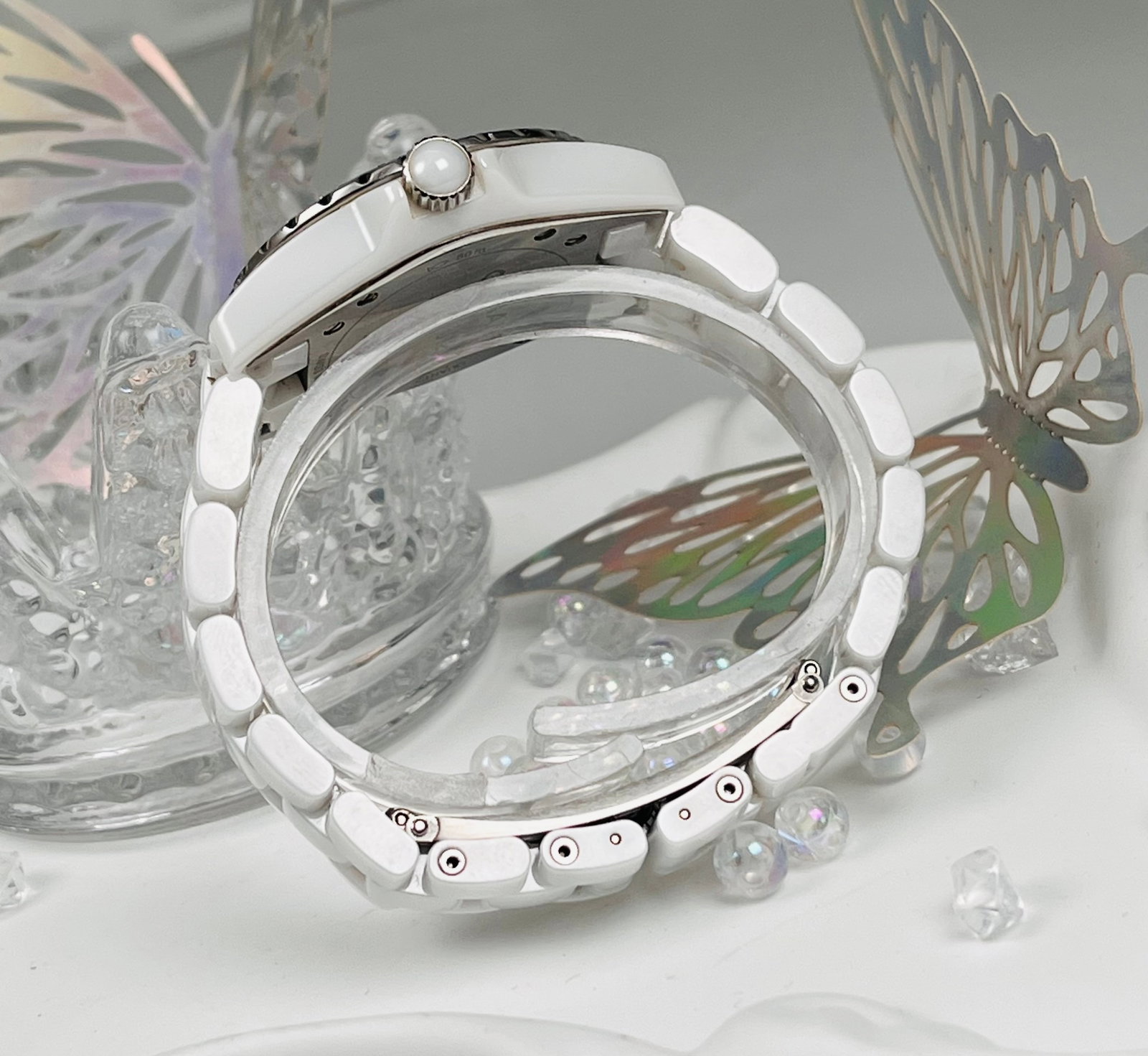 CHANEL.J12 MODEL WATCH: Chanel J12 model H3110, 33mm case diameter, white ceramic, quartz movement, diamond-set bezel with eight diamond hour markers, white lacquer dial, sapphire crystal glass, stainless steel folding clasp