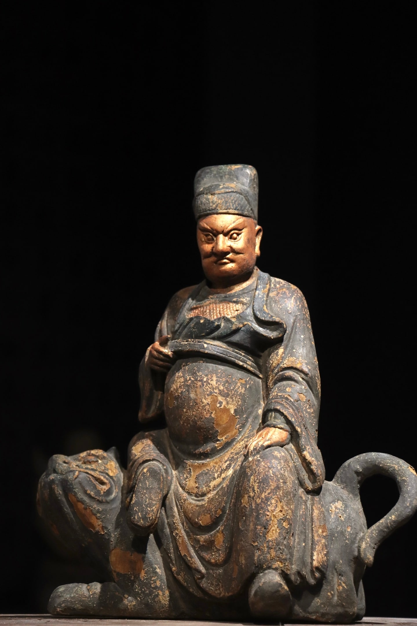 MING DYNASTY NANMU WU CAI SHEN ZHAO GONGMING: H:38cm (14.96in) W:34cm (13.39in) This is a Ming-Qing Dynasty wooden lacquered and gilded painted statue of Zhao Gongming (God of Wealth). Carved from solid wood, it is decorated with lacquer, gilding