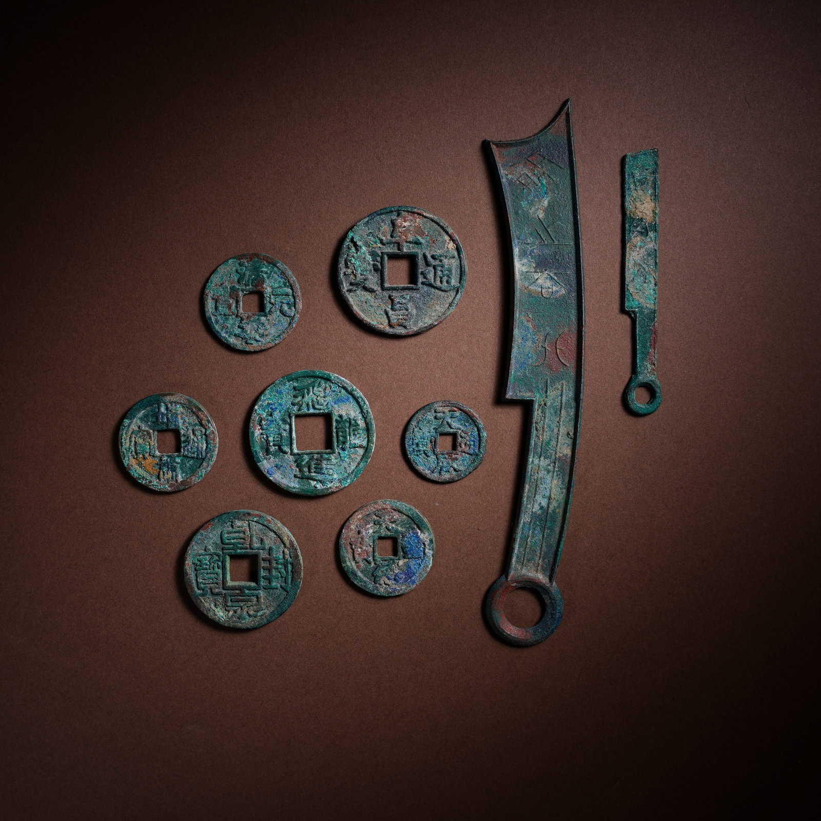 A SET OF NINE ANCIENT CHINESE COINS