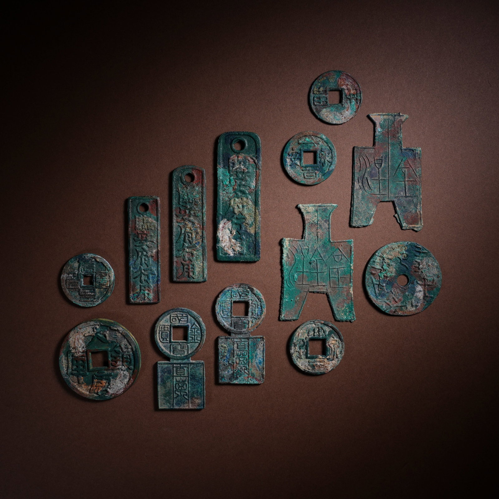 A SET OF THIRTEEN ANCIENT CHINESE COINS (1 of 2)