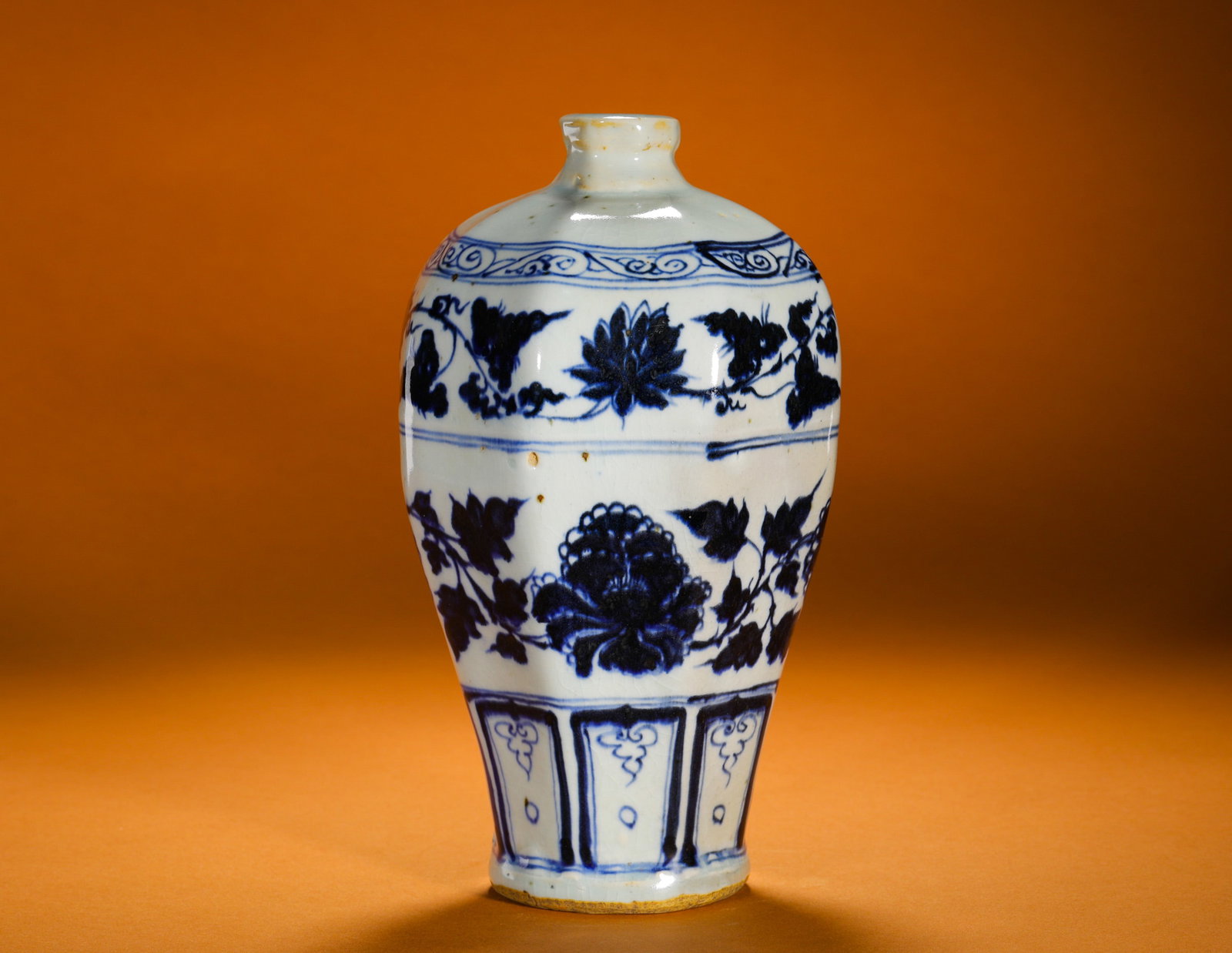YUAN BLUE AND WHITE OCTAGONAL PLUM VASE WITH ENTWINED PEONY BRANCHES: Height:21cm (8.27in)Diameter:13cm (5.12in)Weight:800g(1.76lb)Yuanblueandwhiteoctagonalprunusvase.Smallshortmouth, plumpshoulder, taperedbellyandshallowringfoot, classicYuandecorativeshape.Paintedwithi