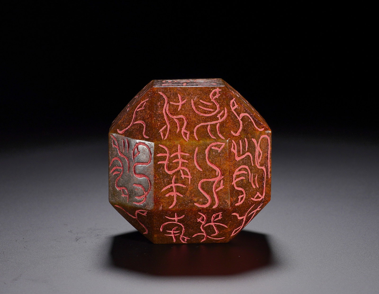 HETIAN JADE POLYHEDRAL BIRD AND INSECT SEAL OF THE HAN DYNASTY: Height:5.8cm (2.28in) Width:5.8cm (2.28in) Weight:400g(0.88lb)Carved from ancient Hetian jade. Each facet is incised with bird-worm seal characters filled with cinnabar, covered by thick russet patina