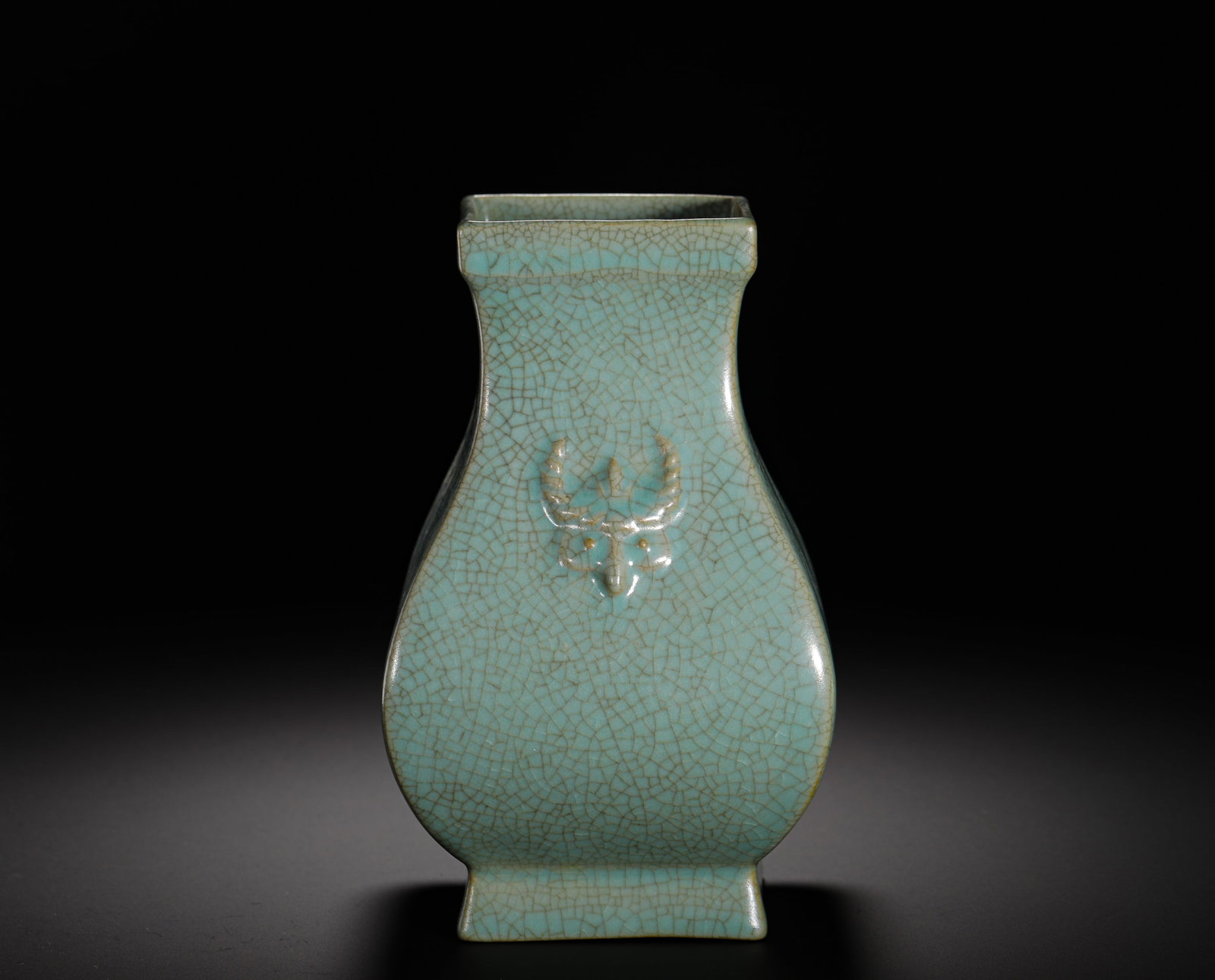 SONG DYNASTY RU KILN SKY BLUE GLAZED SPLIT DEER HEAD SQUARE FLAT POT: Height:18cm (7.09in) Width:11cm (4.33in) Weight:770g(1.70lb)Song Ru kiln square flat vase with deer-head reliefs, covered in uniform sky-celadon glaze with fine natural crackle ice patterns. It featur