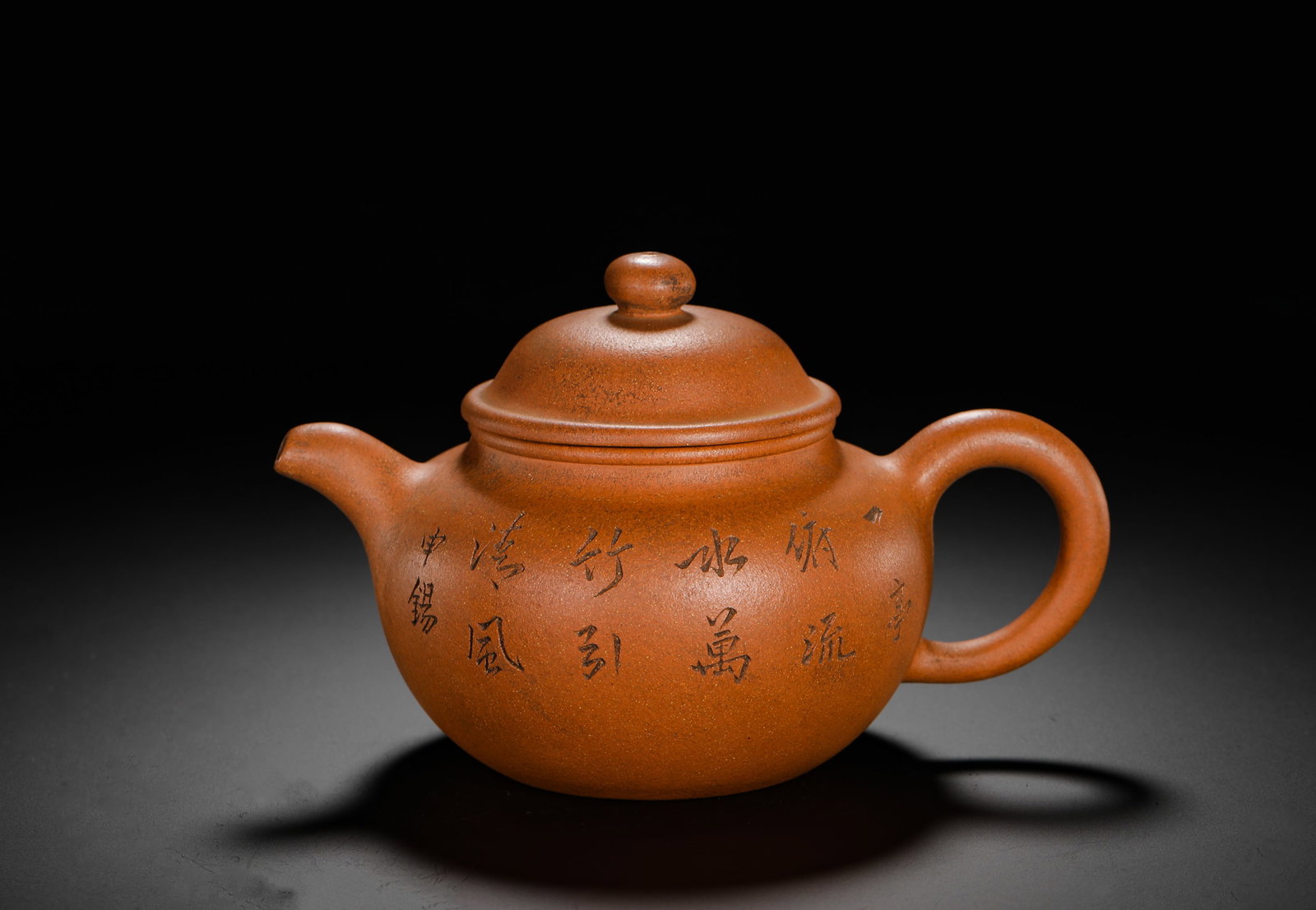 SHEN TIN ENGRAVED PURPLE CLAY TEAPOT: H:11.5cm W:18cm Weight:390g Classic plain Duqiu teapot made of natural Jiangpo clay with fine golden sand speckles and warm antique tone. Double-layer spherical plump body, tightly fitted overlaid lid