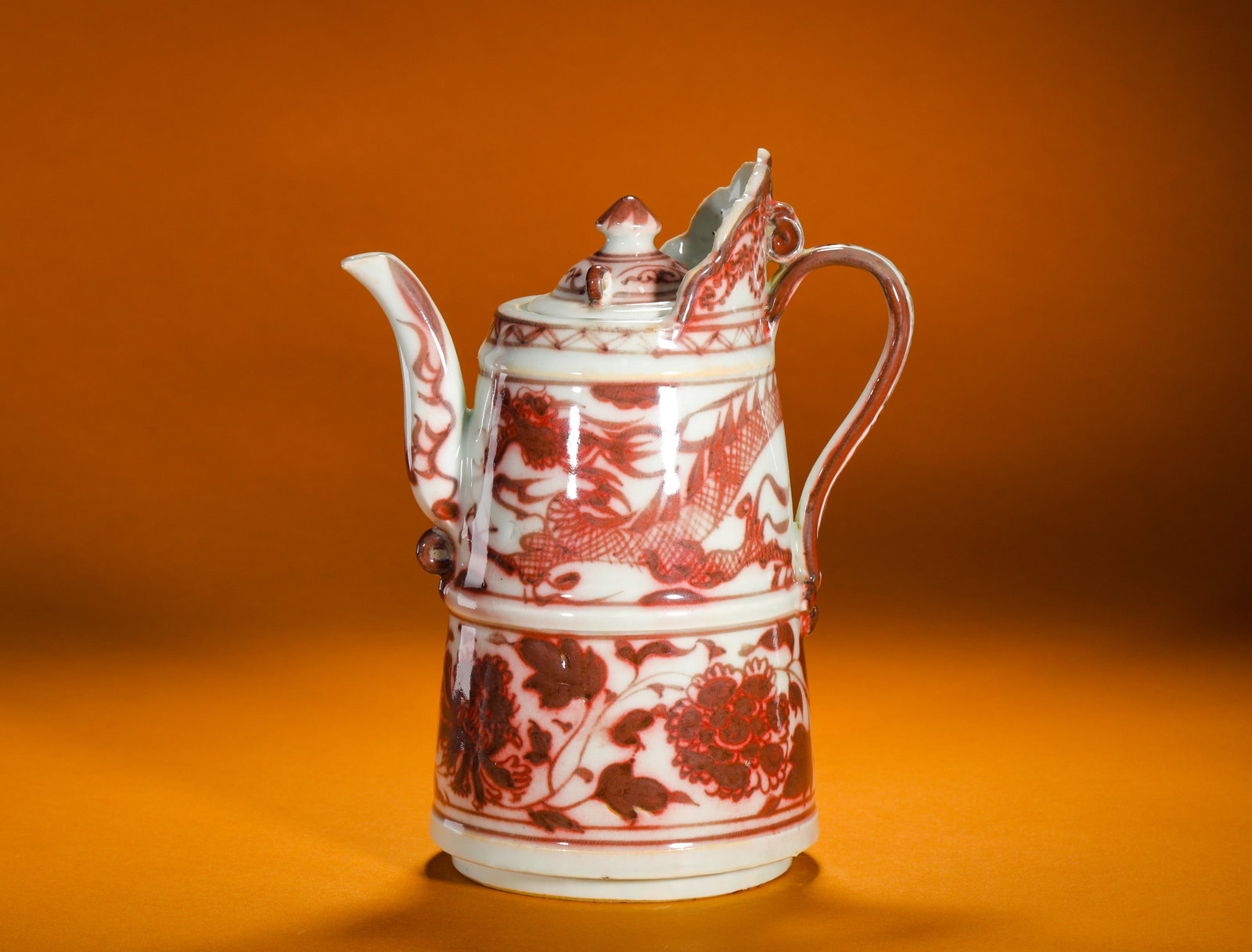 YUAN DYNASTY UNDERGLAZE RED DRAGON-PATTERNED PEONY MONK'S CAP POT: Height:22cm (8.66in)Width:17cm (6.69in)Weight:1070g(2.36lb)Antiqueunderglazeredmonk-capewer, dragon&peonymotif, rareBuddhistteaimperialporcelain.