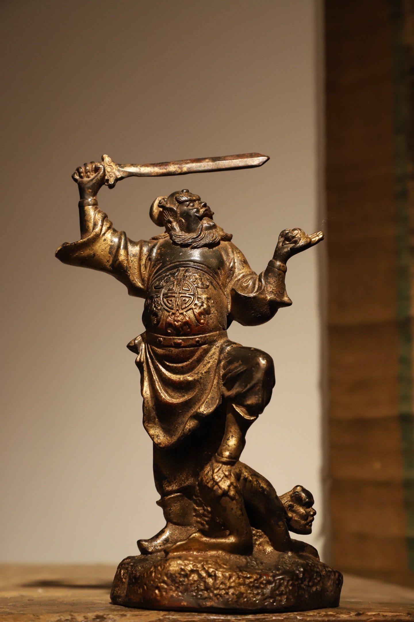ZHONG KUI STATUES FROM THE MING DYNASTY: Weight:800g(1.76lb) H:21cm (8.27in) L:13cm (5.12in) W:9cm (3.54in) This is a gilded bronze statue of Zhong Kui Subduing Demons from the Ming Dynasty. Cast from fine bronze with overall gilding, the st